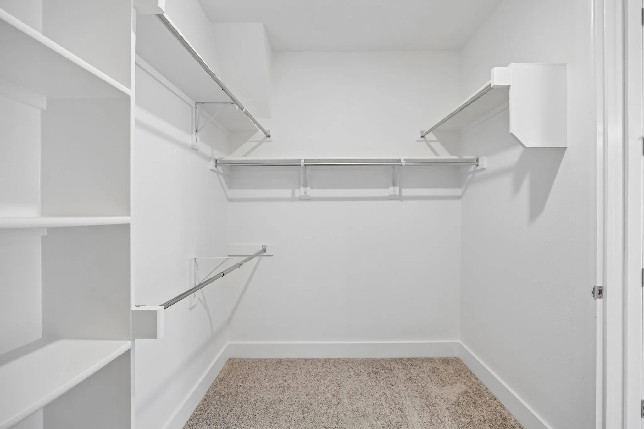 Generous Walk-In Closet
Designed to accommodate a substantial wardrobe, this oversized closet offers abundant hanging space, shelving, and organization options.
