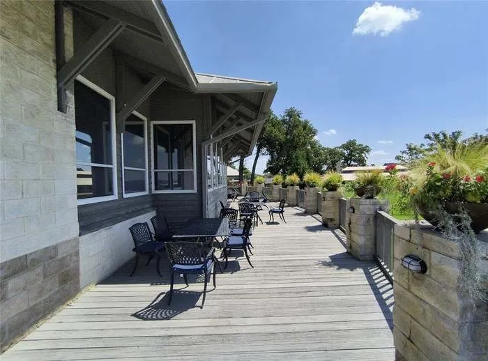 Expansive outdoor deck featuring wood-finish flooring