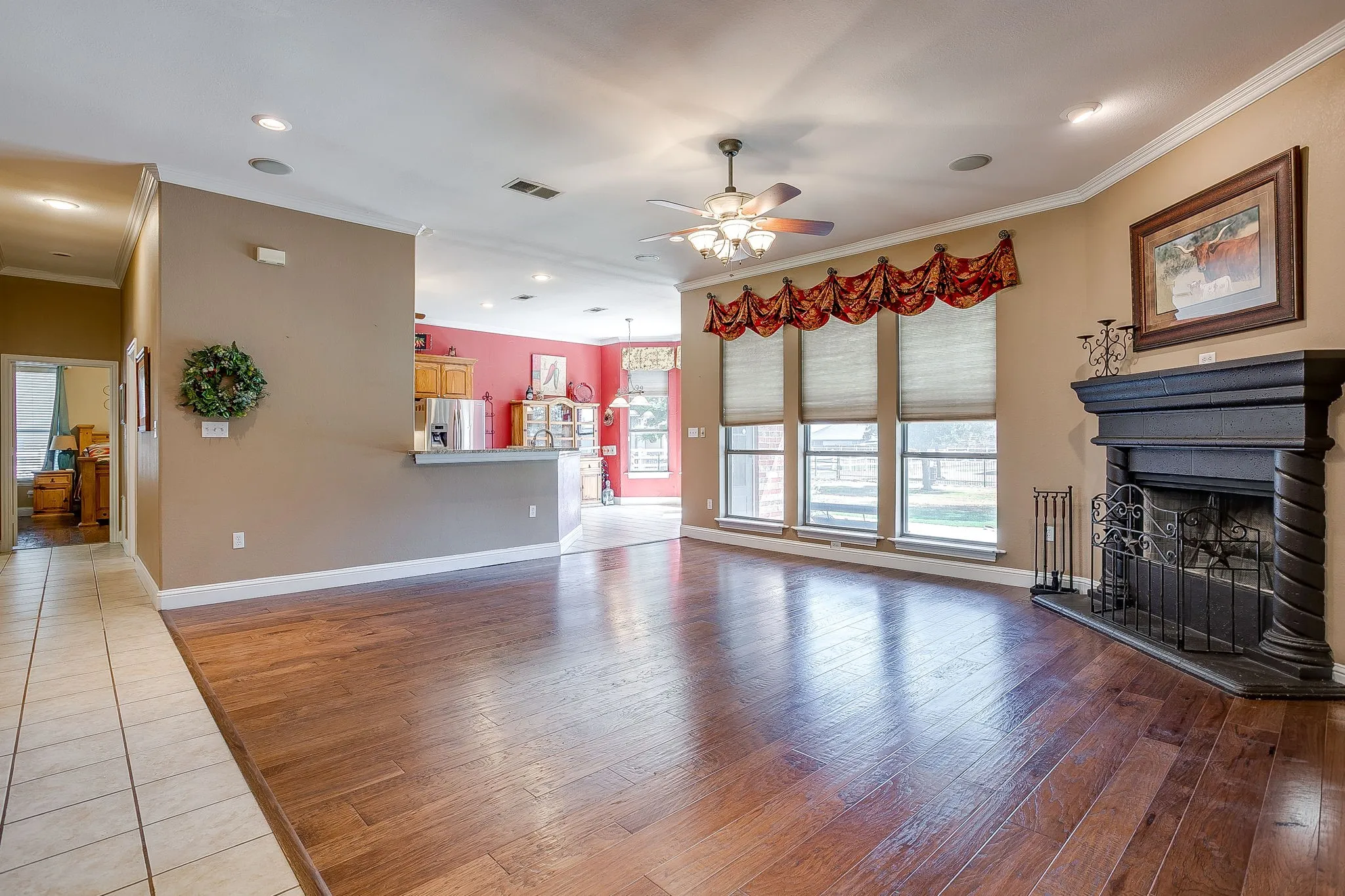 Hardwood-finish flooring, recessed lighting, and crown molding