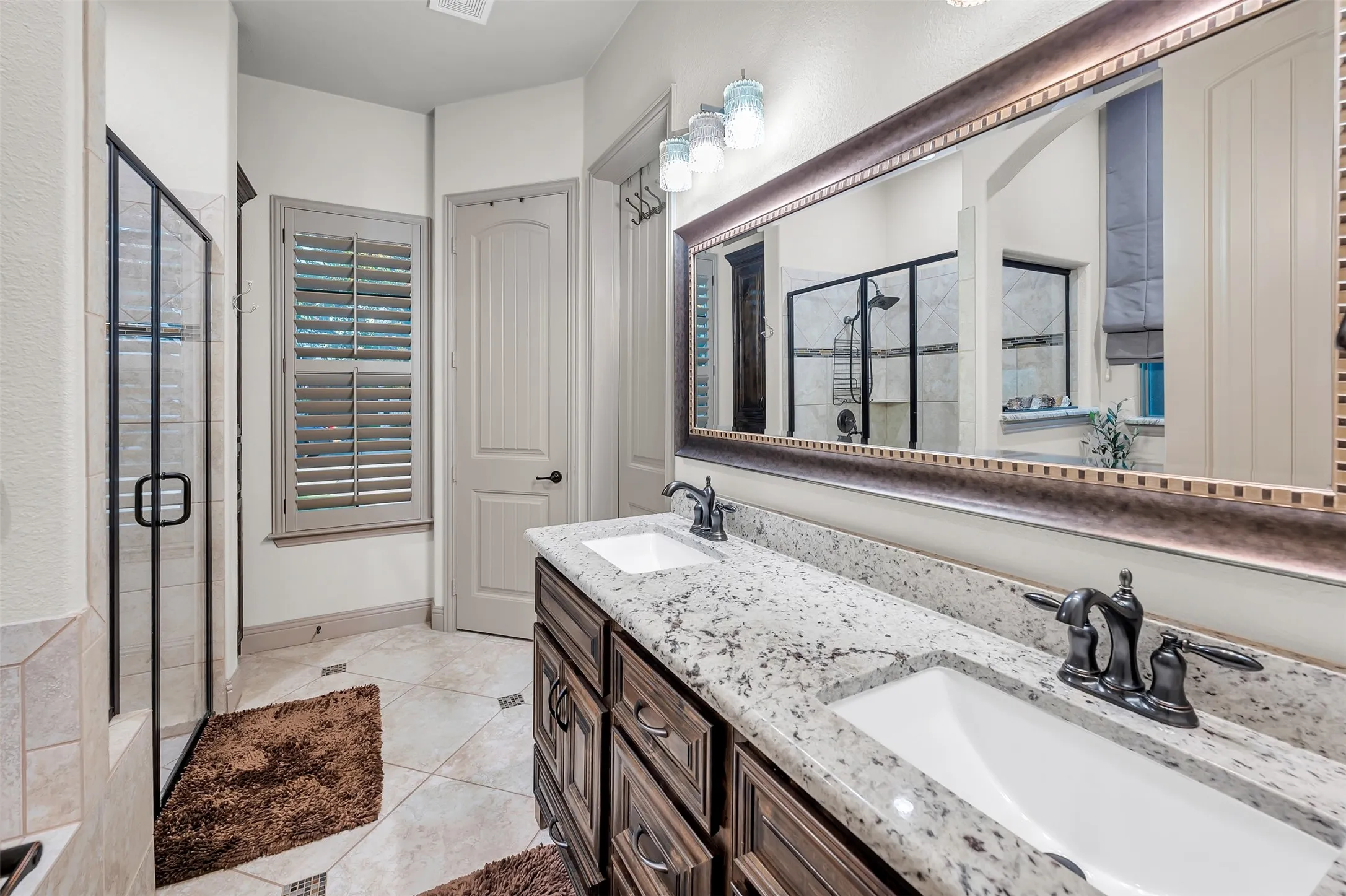 Dual vanity with granite countertops and undermount sinks