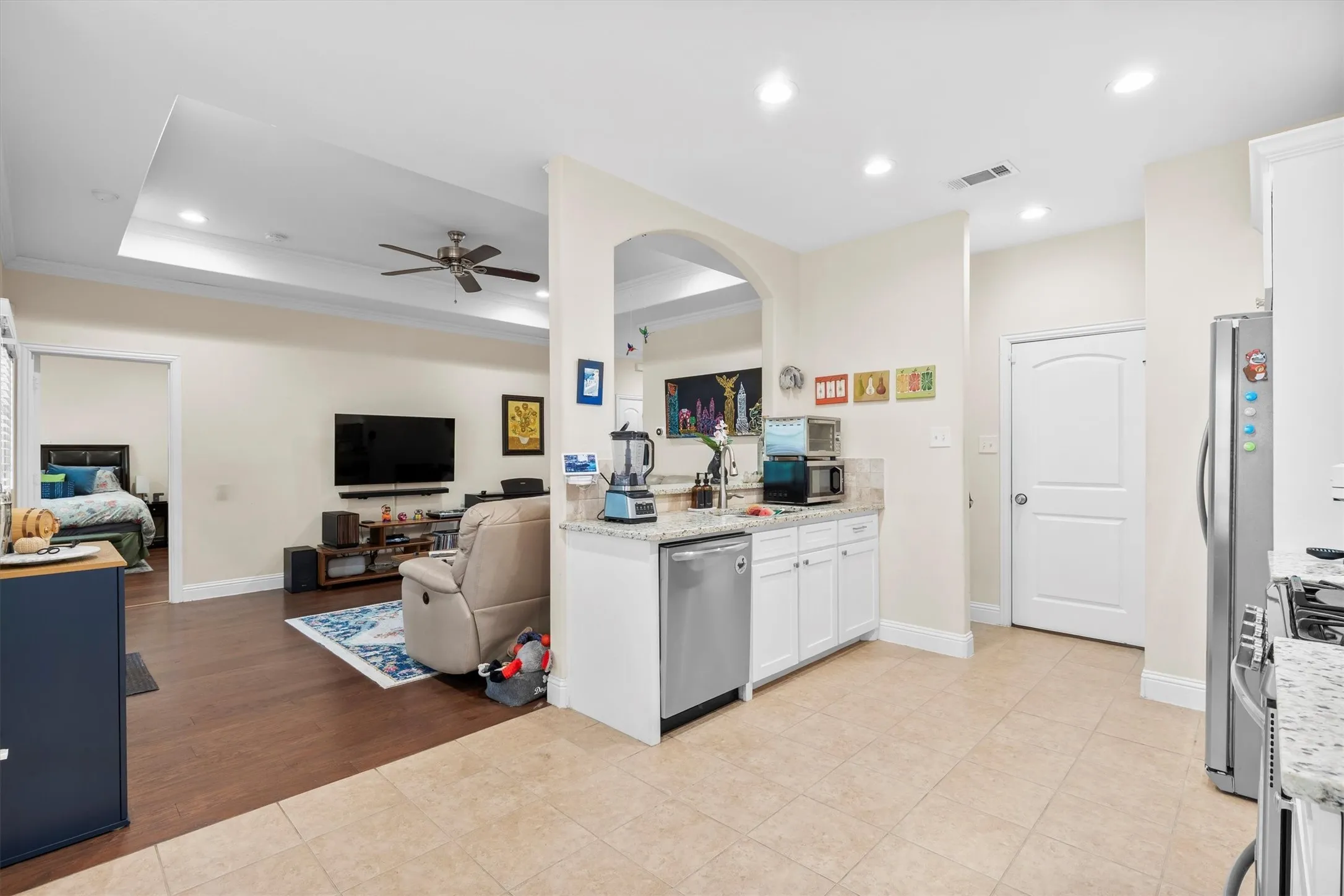 Kitchen with tile flooring and granite-style countertops