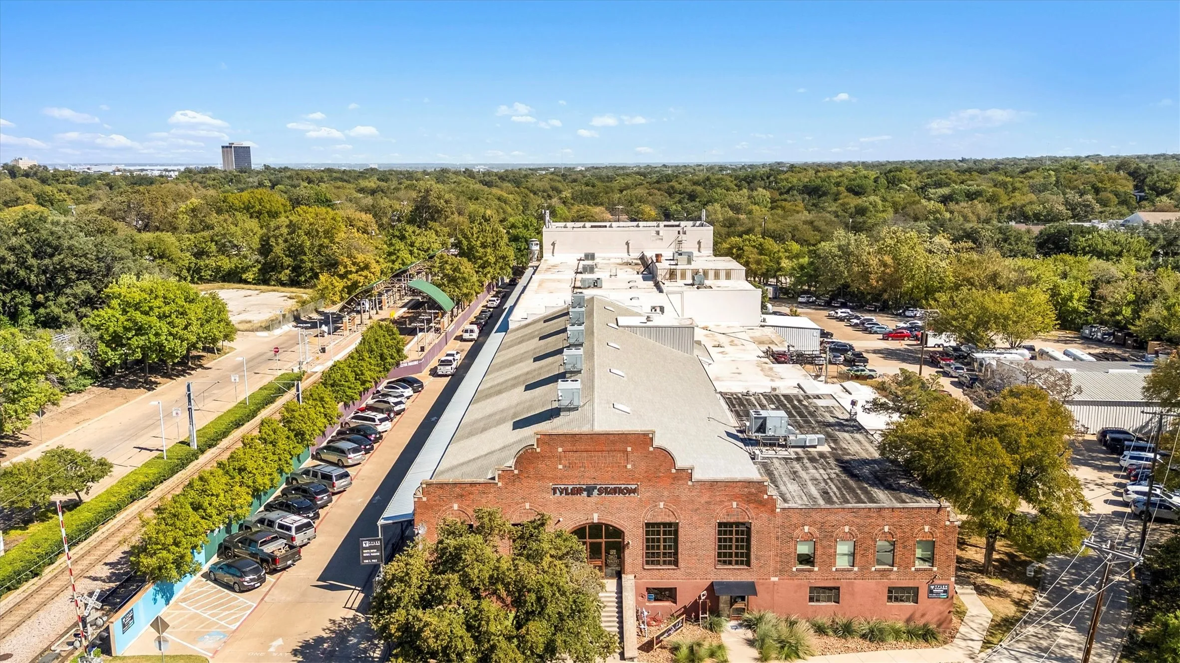 Historic brick building featuring multiple windows and a distinct architectural profile