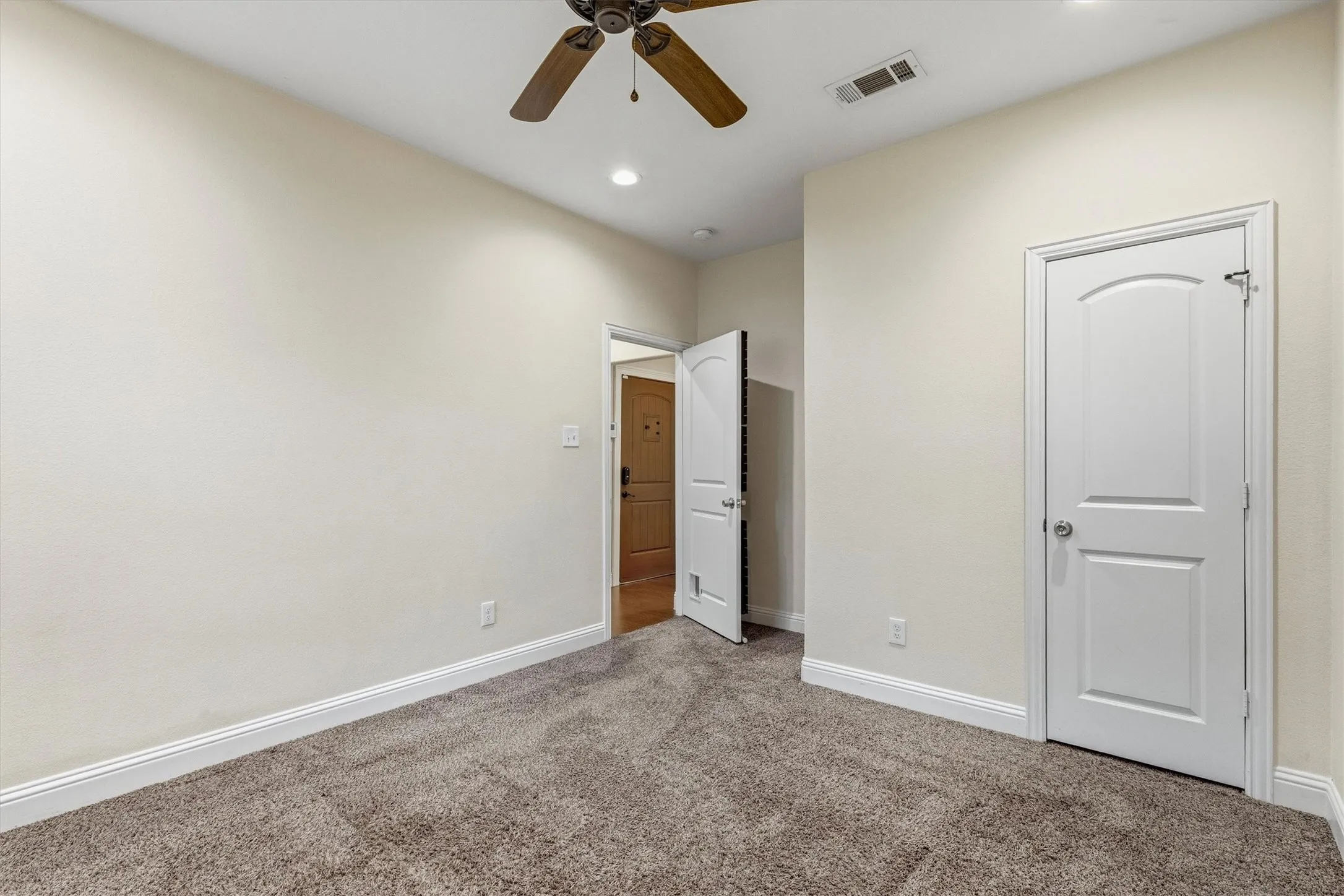 Plush carpet flooring, recessed lighting, ceiling fan, and white trim