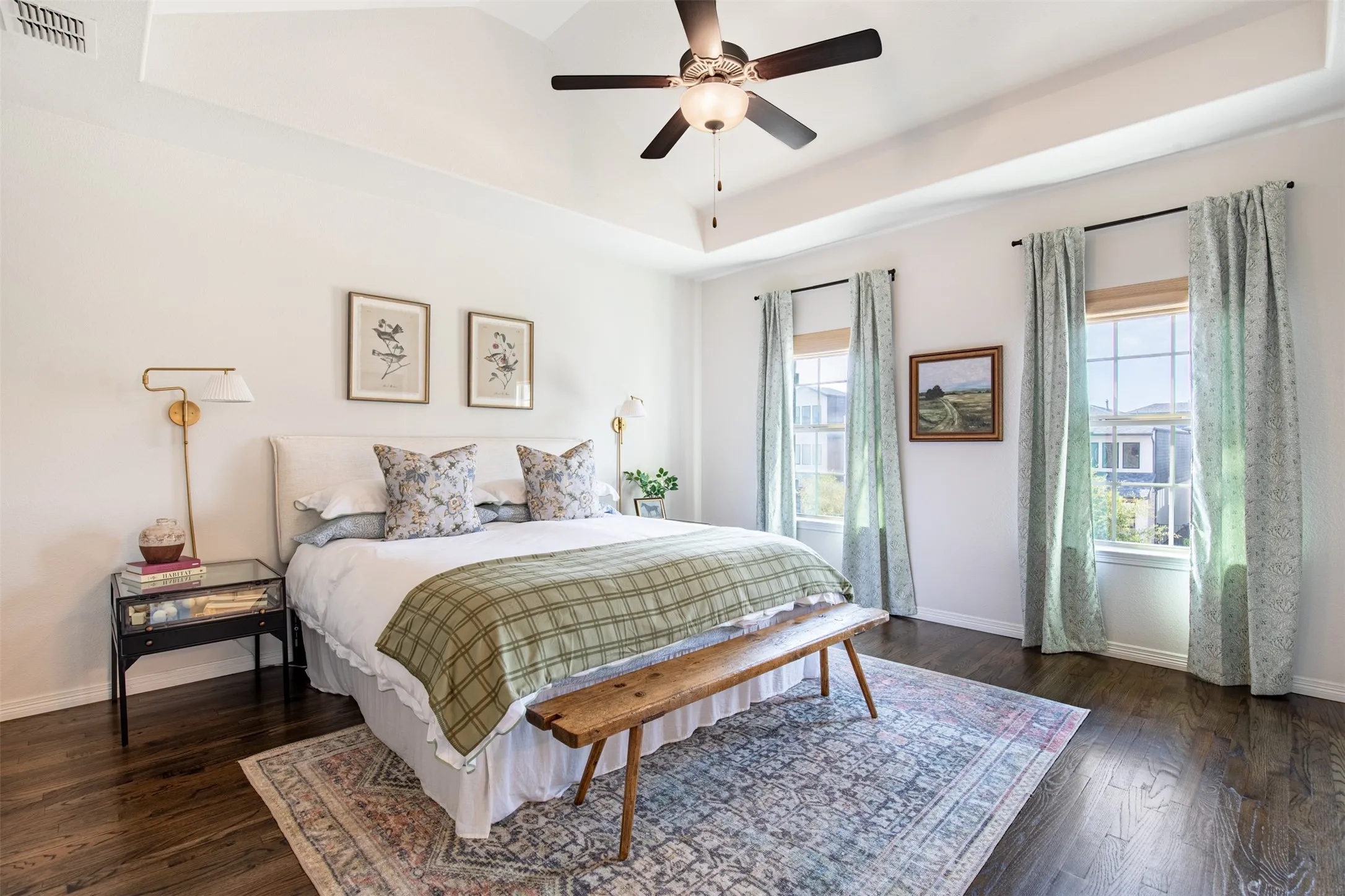 Spacious primary bedroom with vaulted ceilings