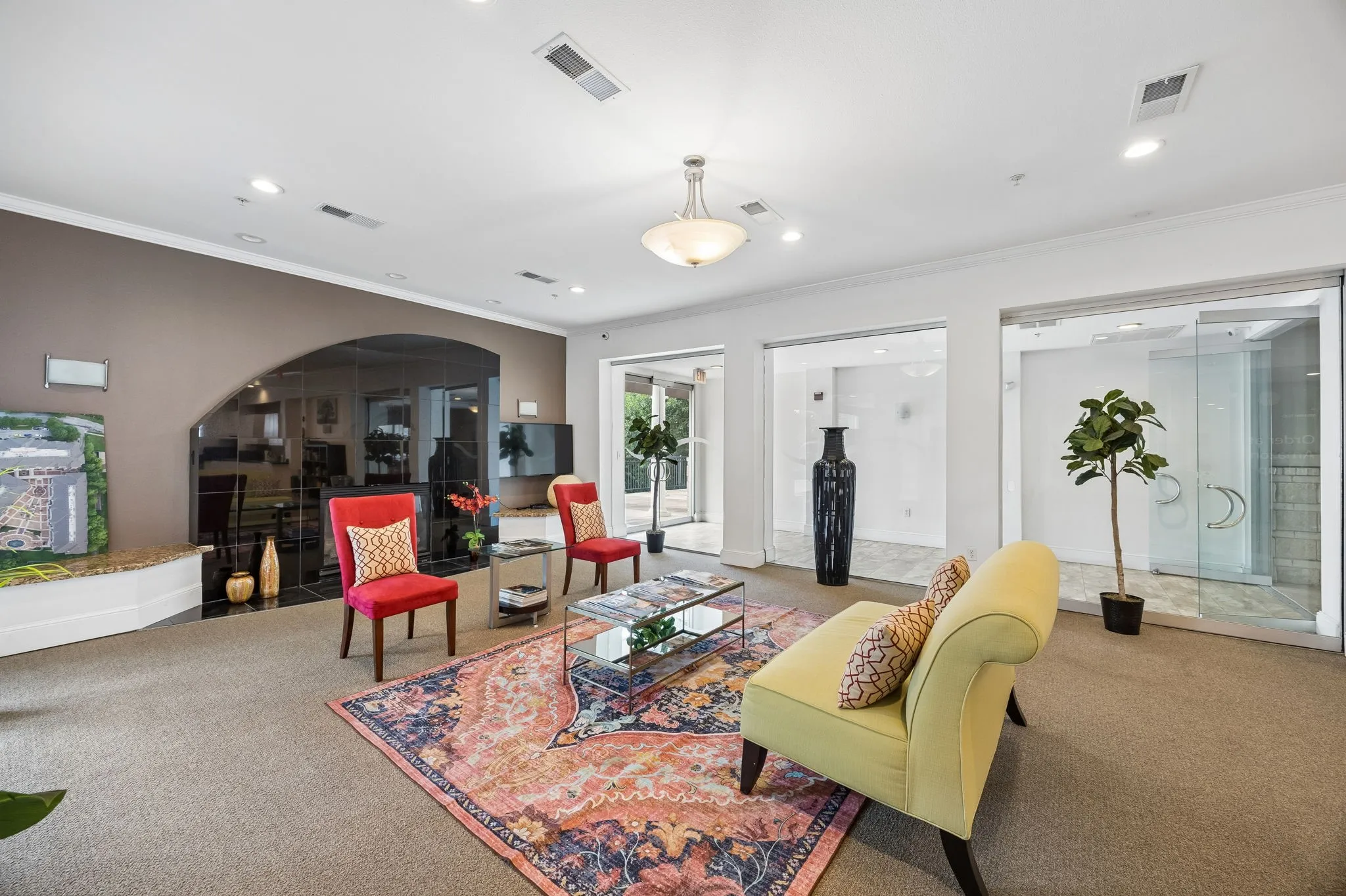 Spacious interior featuring recessed lighting, crown molding, and glass partitions