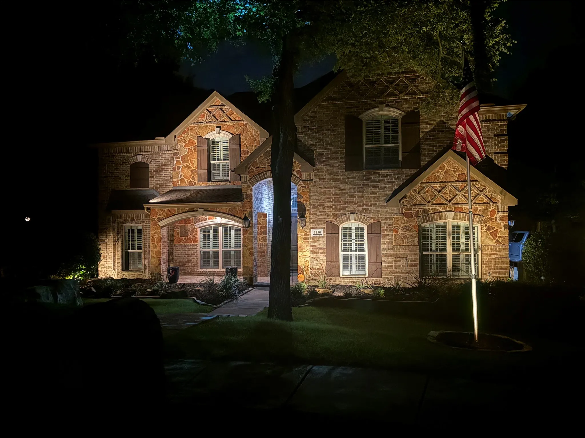 Charming brick front elevation showcasing timeless architectural details and a welcoming entry.
