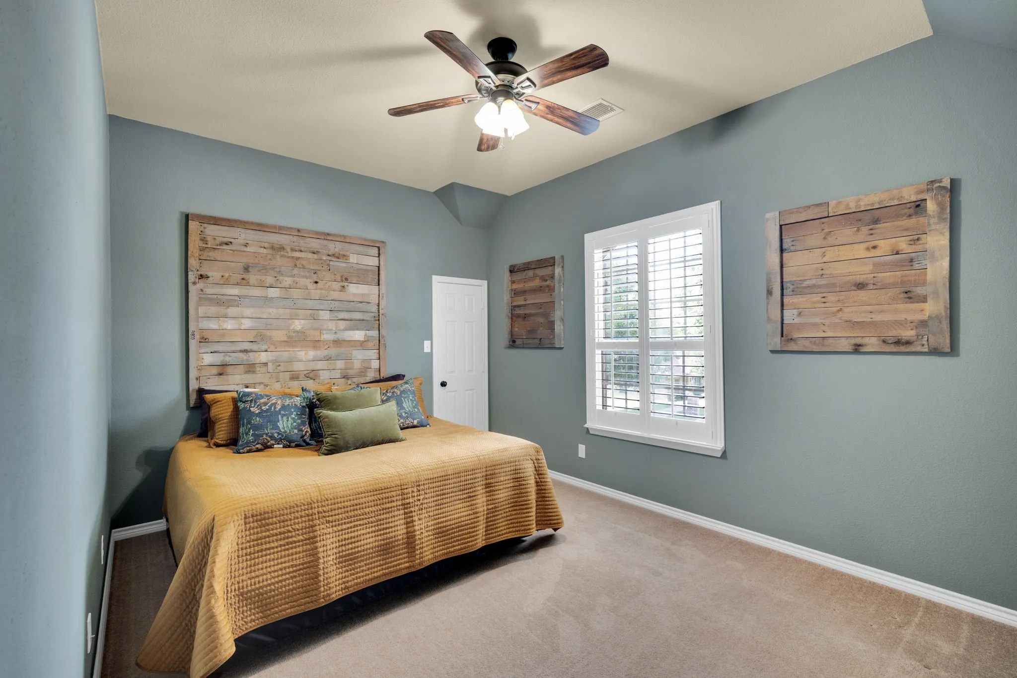 Secondary bedroom with a large window and neutral tones, ready to fit any lifestyle.