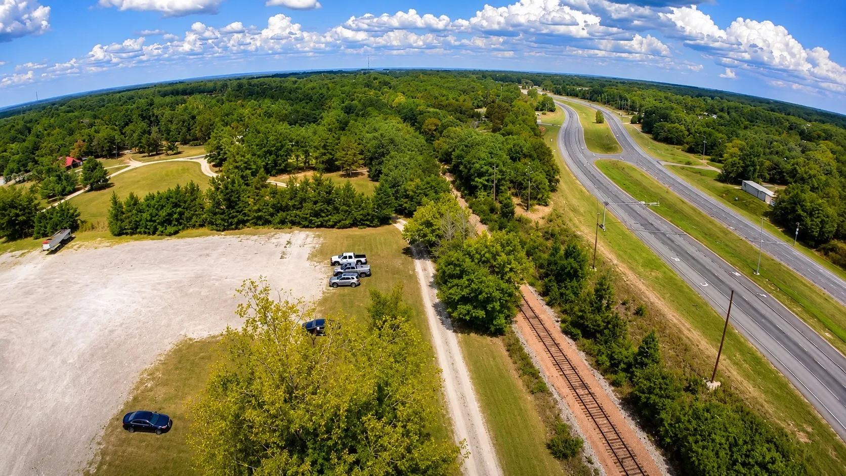 Expansive cleared land area featuring a gravel surface