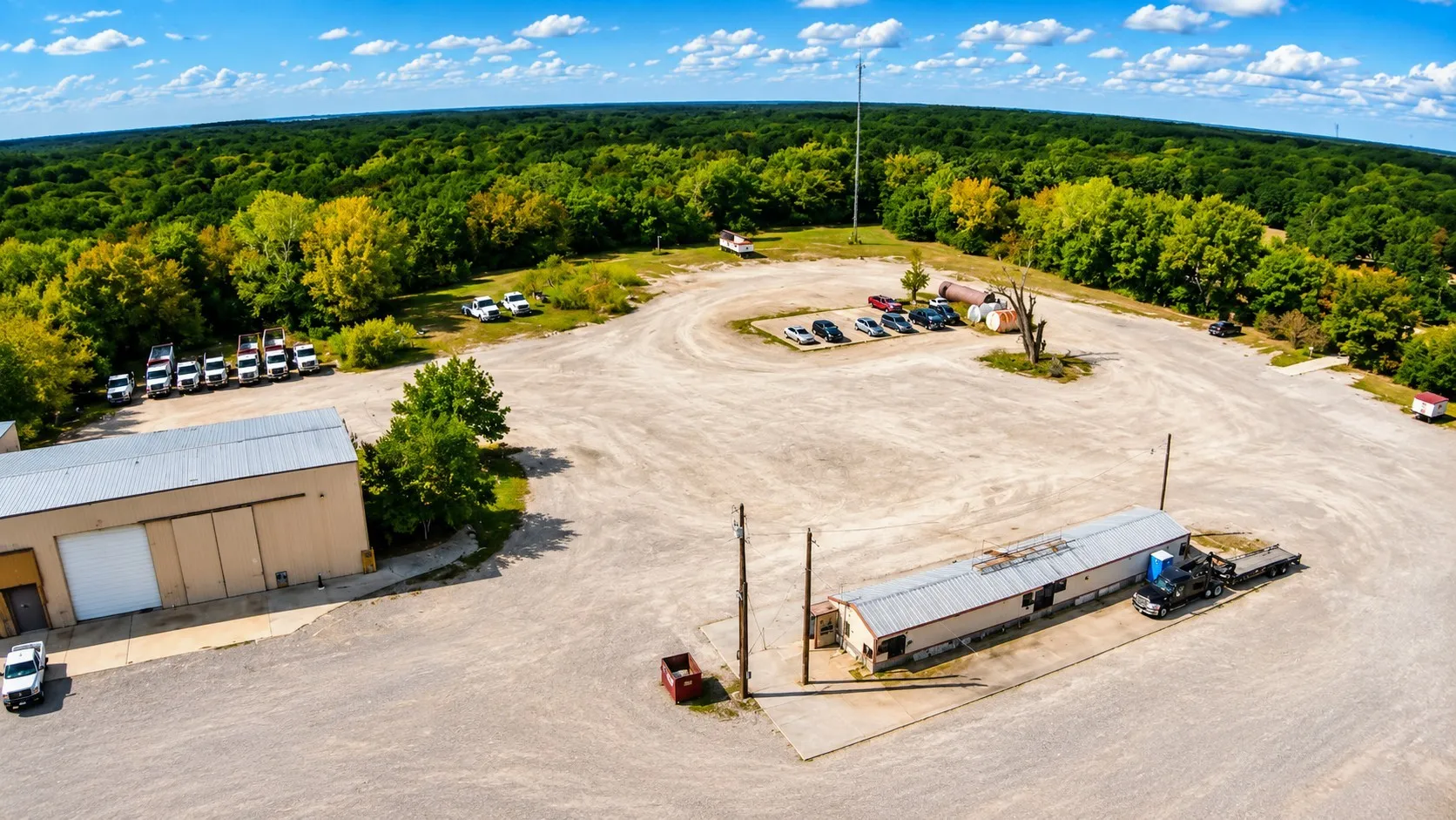 Expansive gravel lot with multiple structures