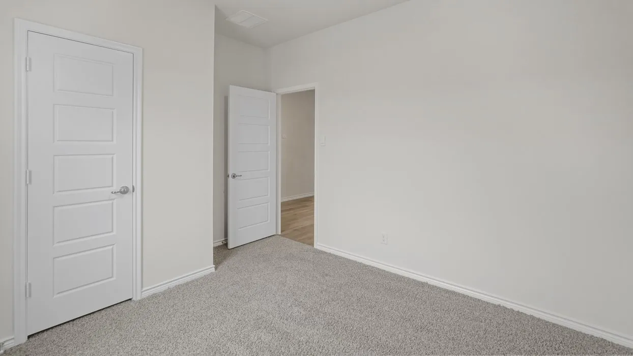 Neutral wall paint and plush carpeting establish a versatile foundation