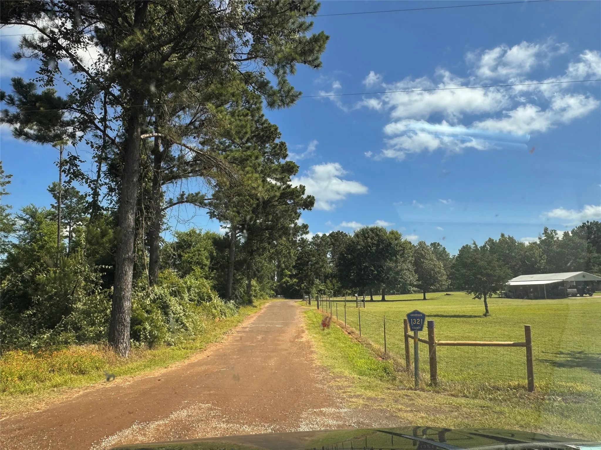 Anderson County Road 1321 runs down the side of the property