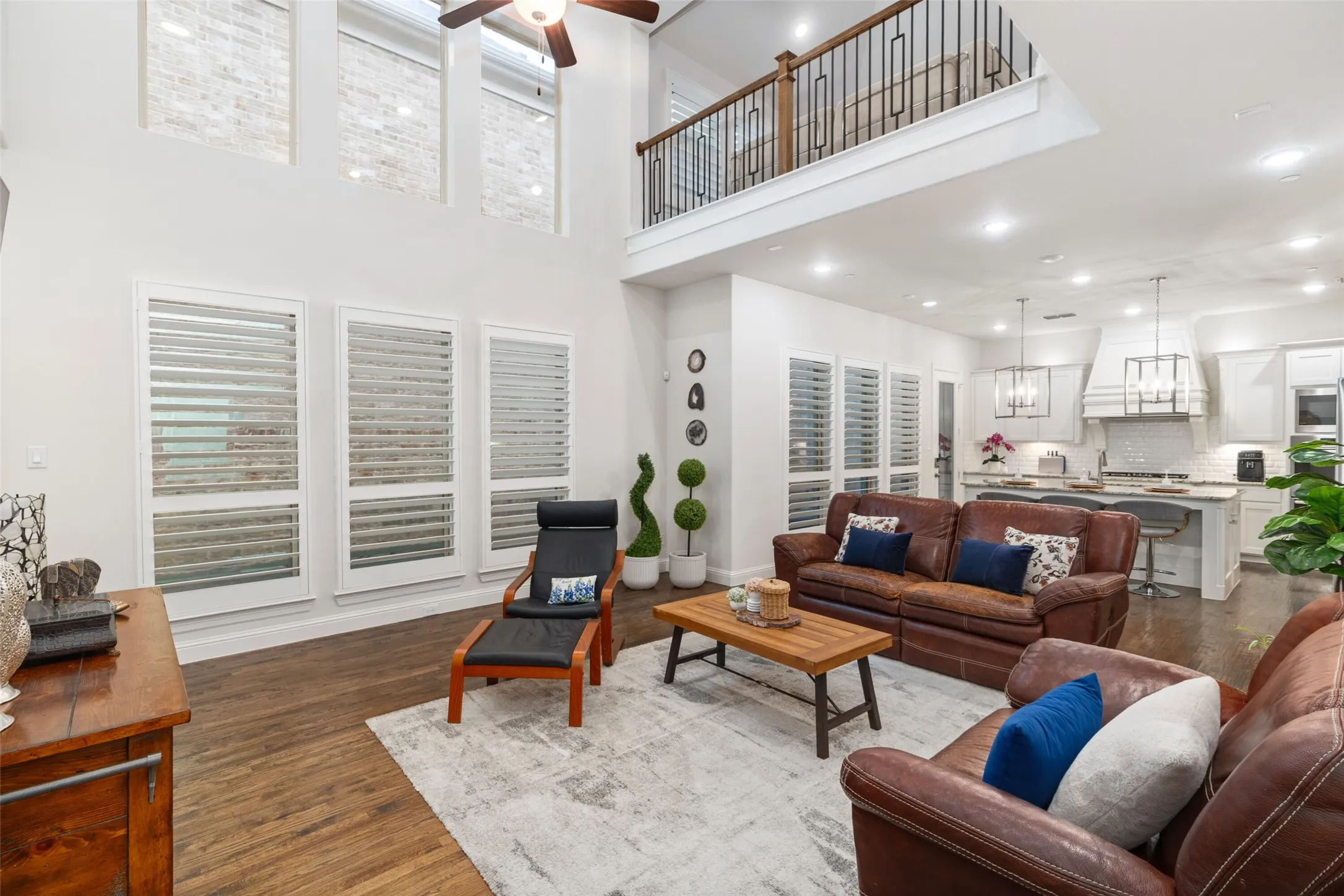 Beautiful spacious living room with high ceiling and floor to ceiling windows
