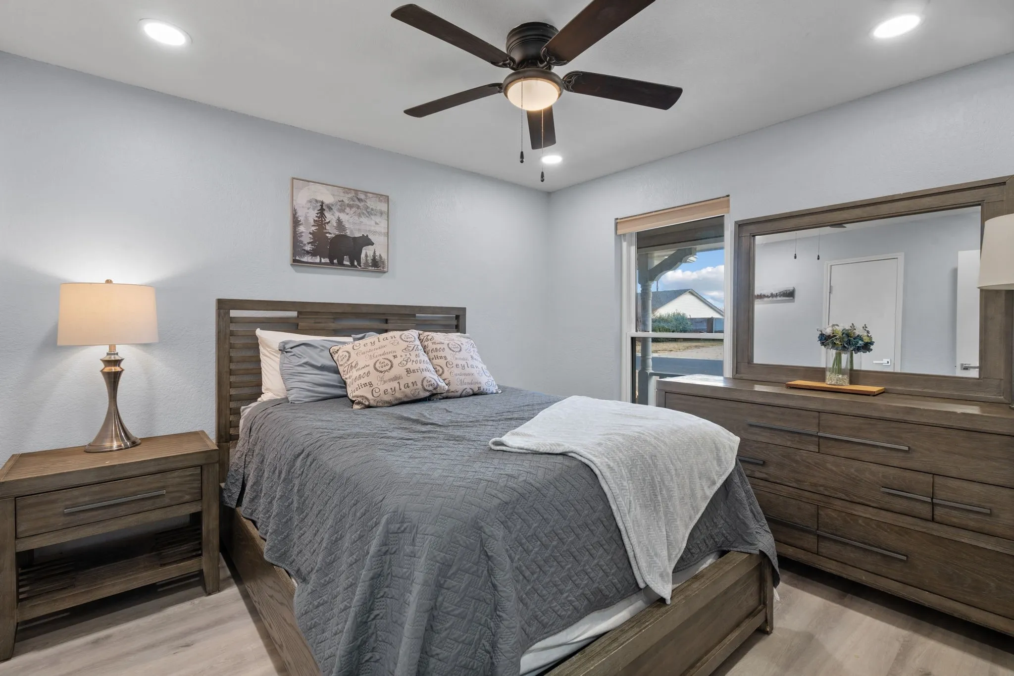 Bedroom featuring wood-finish flooring, recessed lighting, and a ceiling fan with integrated light