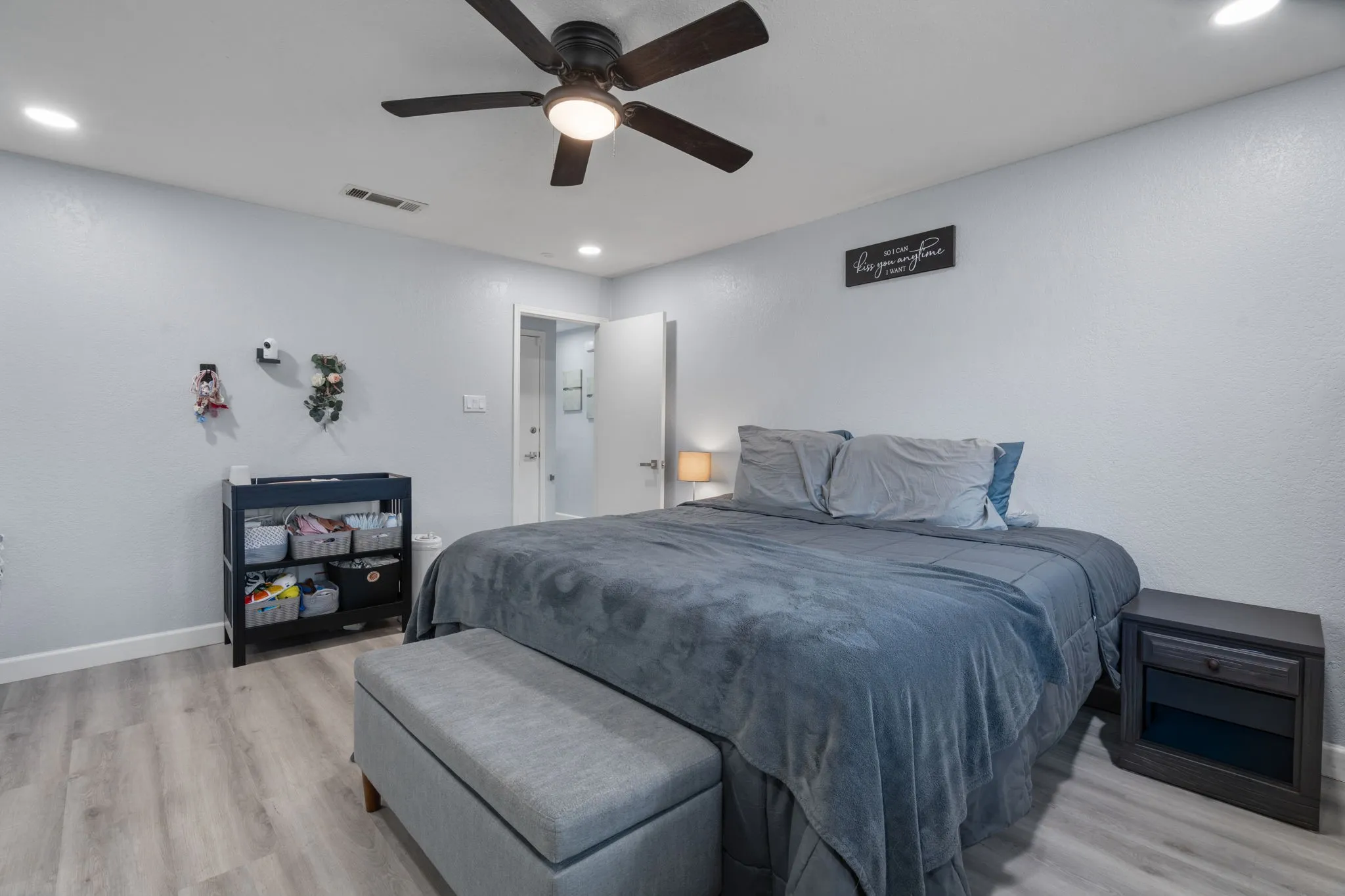 Bedroom featuring wood-finish flooring, recessed lighting, and a ceiling fan with integrated light