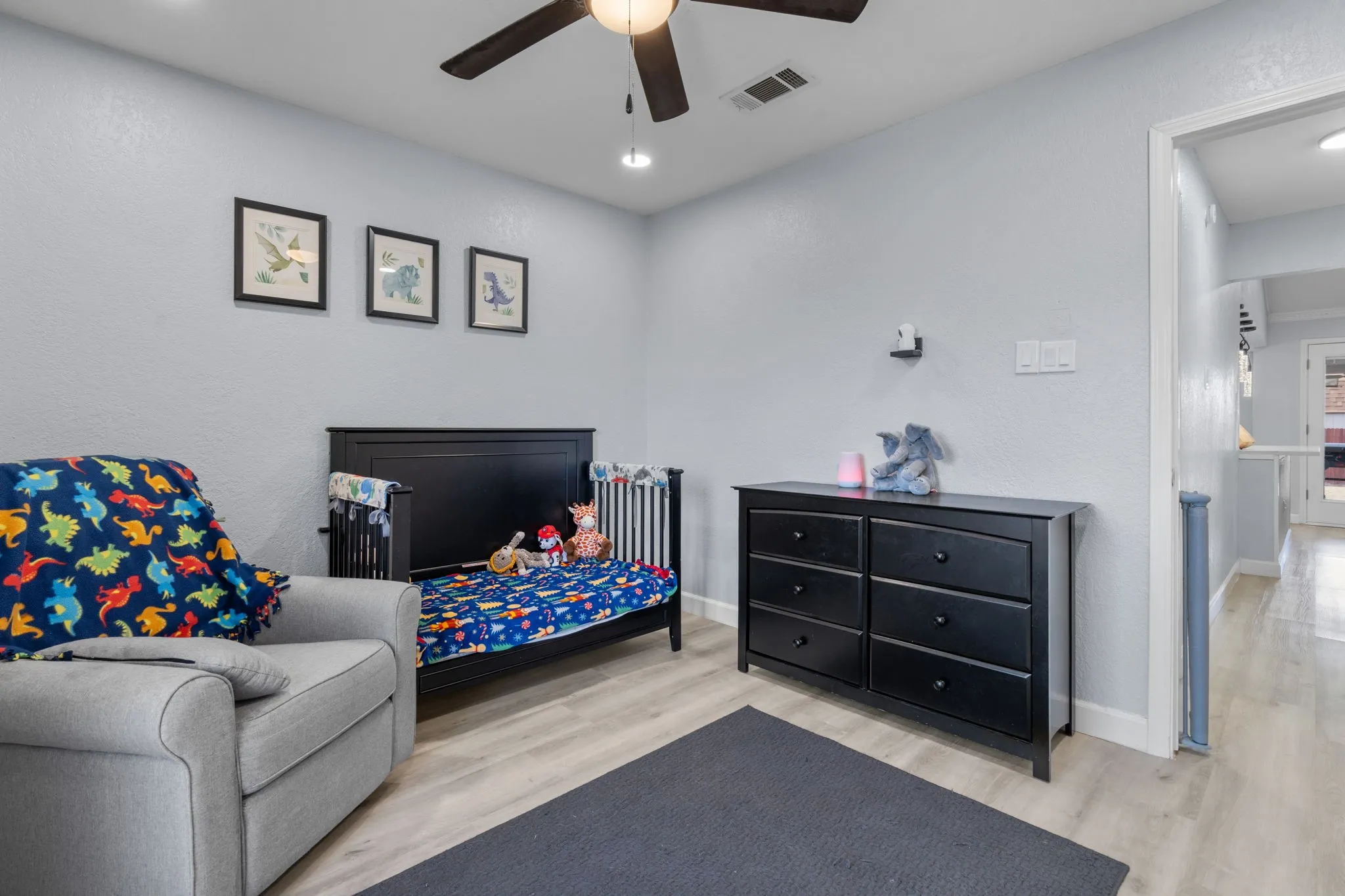 Light gray walls complemented by wood-finish flooring