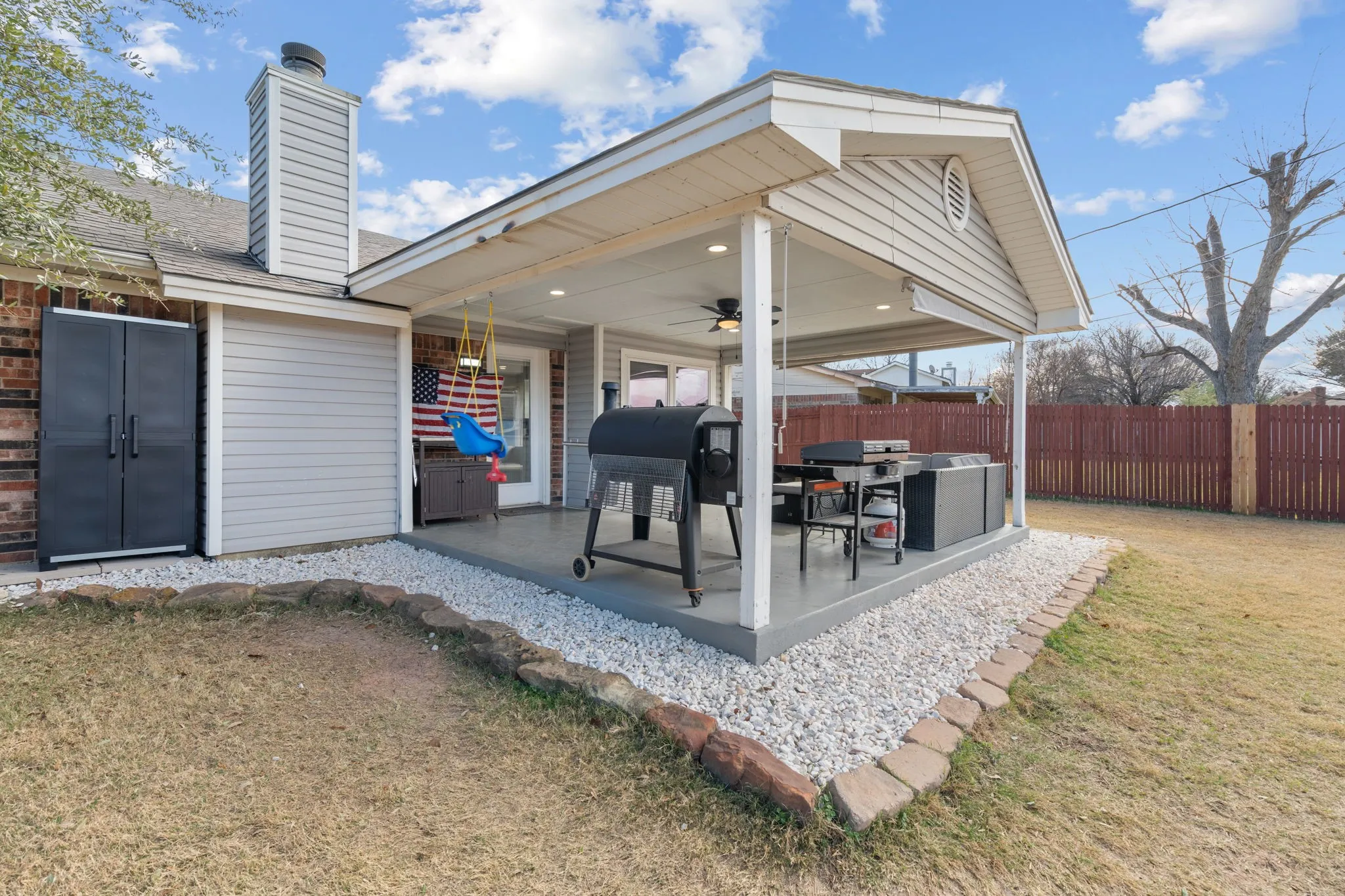 Covered patio with a painted concrete surface, recessed lighting, and a ceiling fan