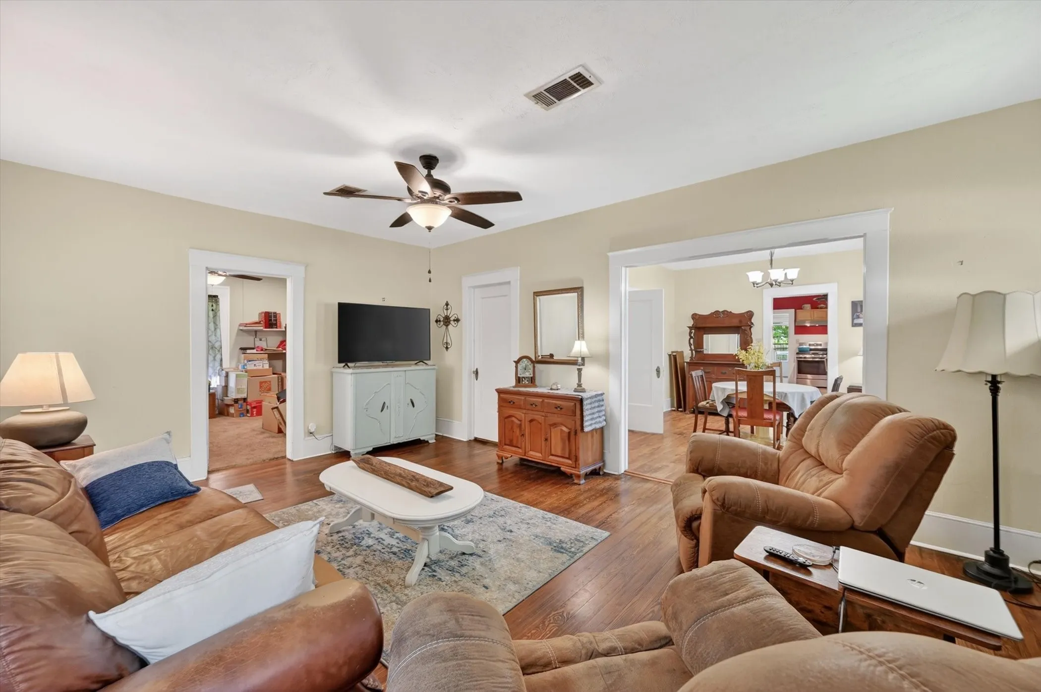 Hardwood-finish flooring throughout, complemented by light-toned wall paint and white trim