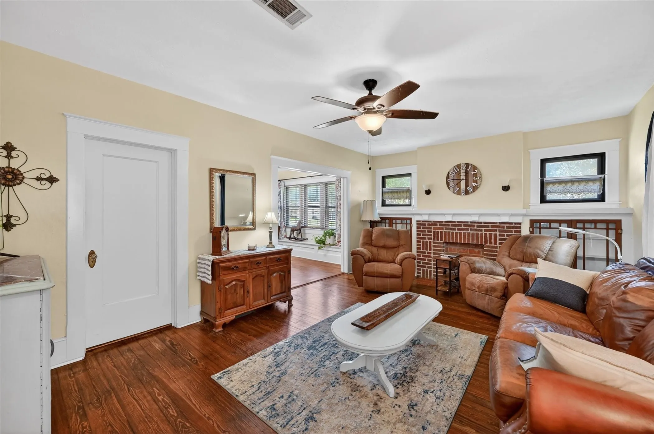 Warm wood-finish flooring complements the light wall tones