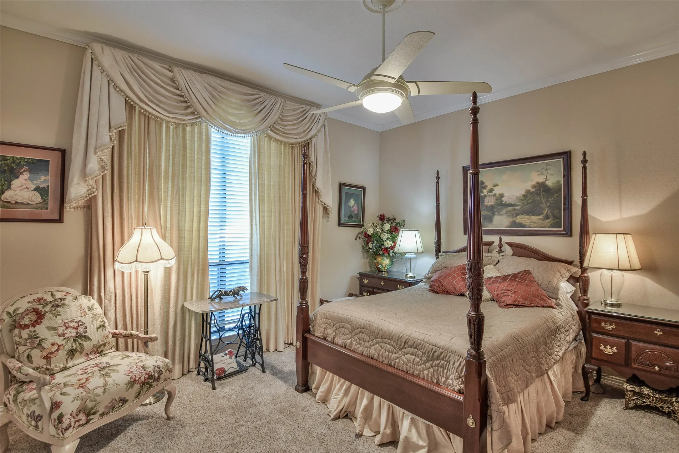 Bedroom with crown molding, carpet flooring, and ceiling fan