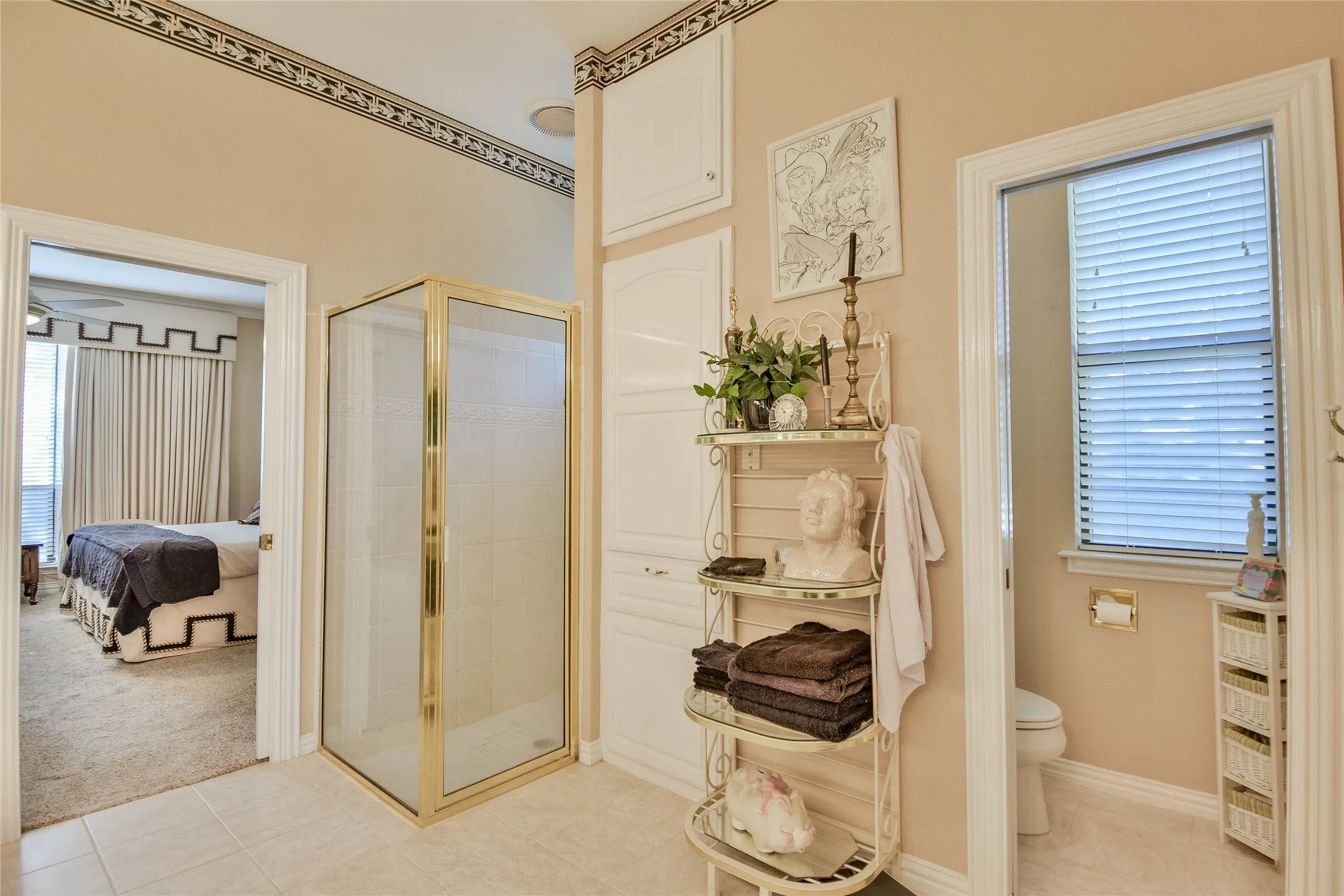 Full bath featuring a stall shower, ensuite bathroom, and light tile patterned floors
