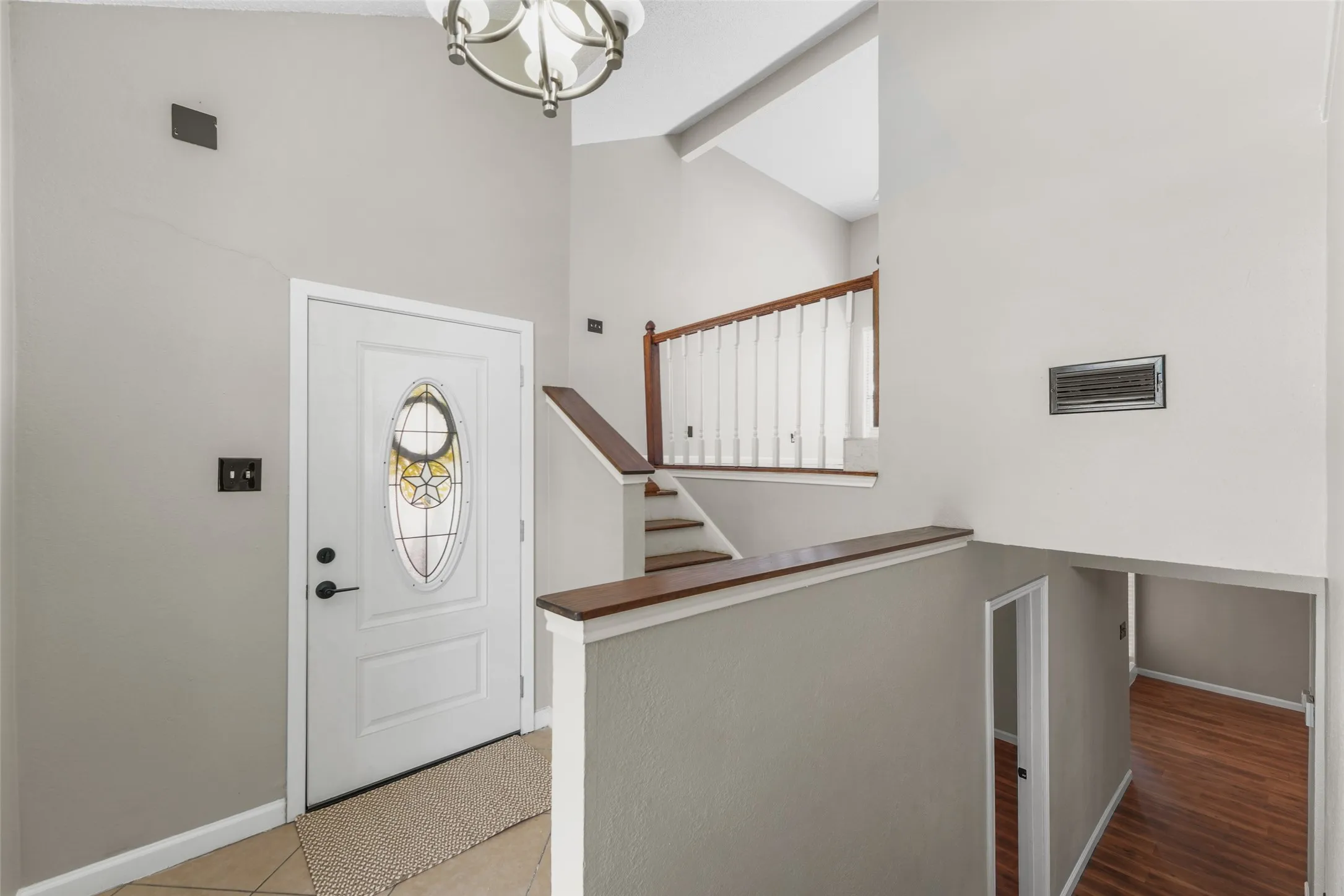 Upon Entry Both Stairways Lead to Upper & Lower Living Spaces
