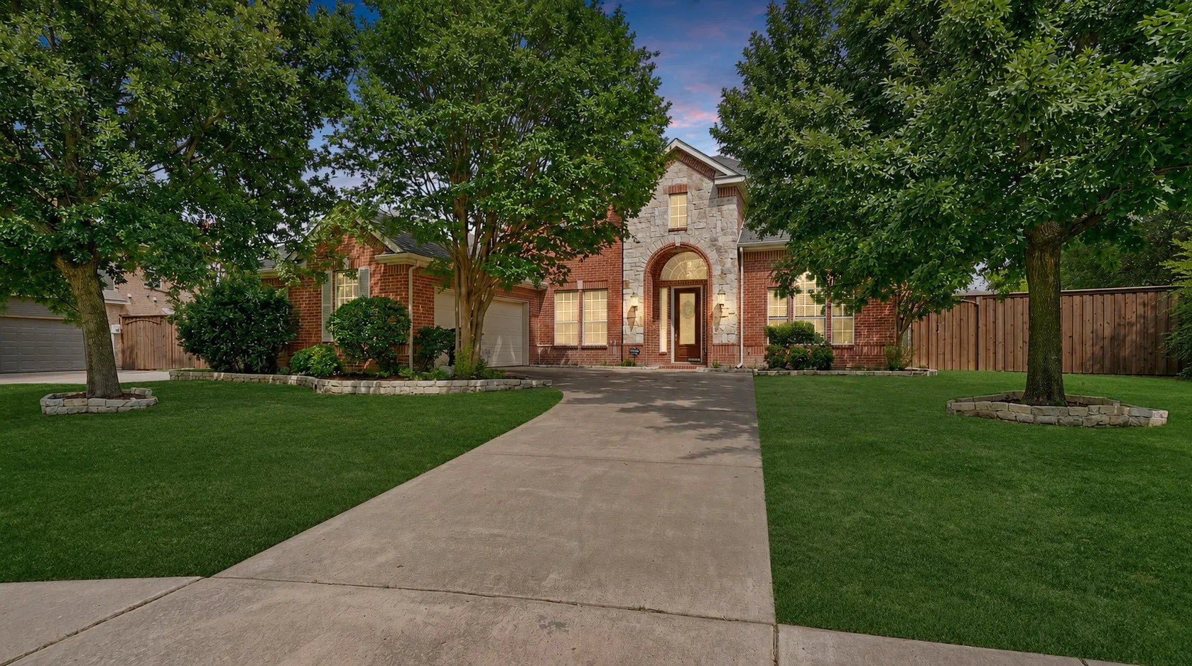 Positioned on an expansive corner lot, the home's impressive architecture and mature landscaping provide both presence and privacy in one of Hunter's Landing's most desirable settings.