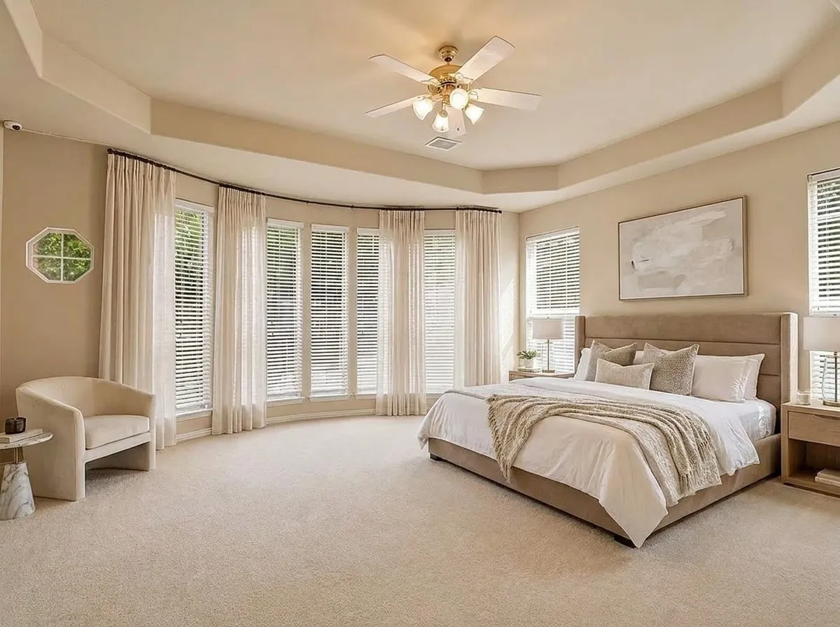 Generously sized with architectural detailing and abundant natural light, the primary suite offers a peaceful retreat at the end of every day. Image has been virtually staged and digitally modified.