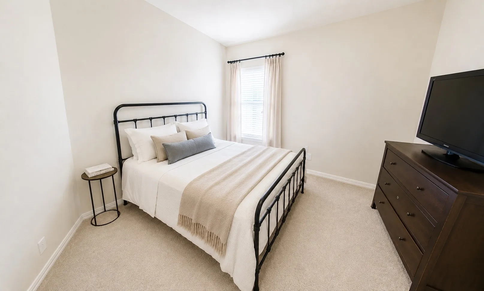 Privately positioned away from the other upstairs bedrooms, this generously sized guest suite features its own ensuite bath and spacious closet, creating a comfortable retreat for overnight guests, multigenerational living, or an occupant seeking additional privacy. Image has been virtually staged and digitally modified.