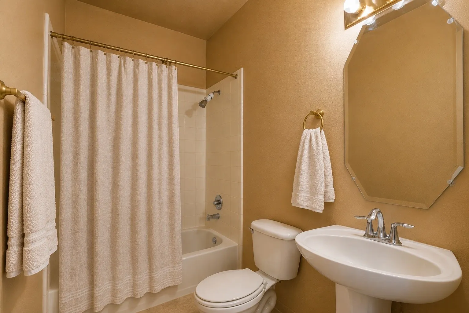 Conveniently located on the main level, this full bathroom comfortably serves guests and the adjacent secondary bedroom.