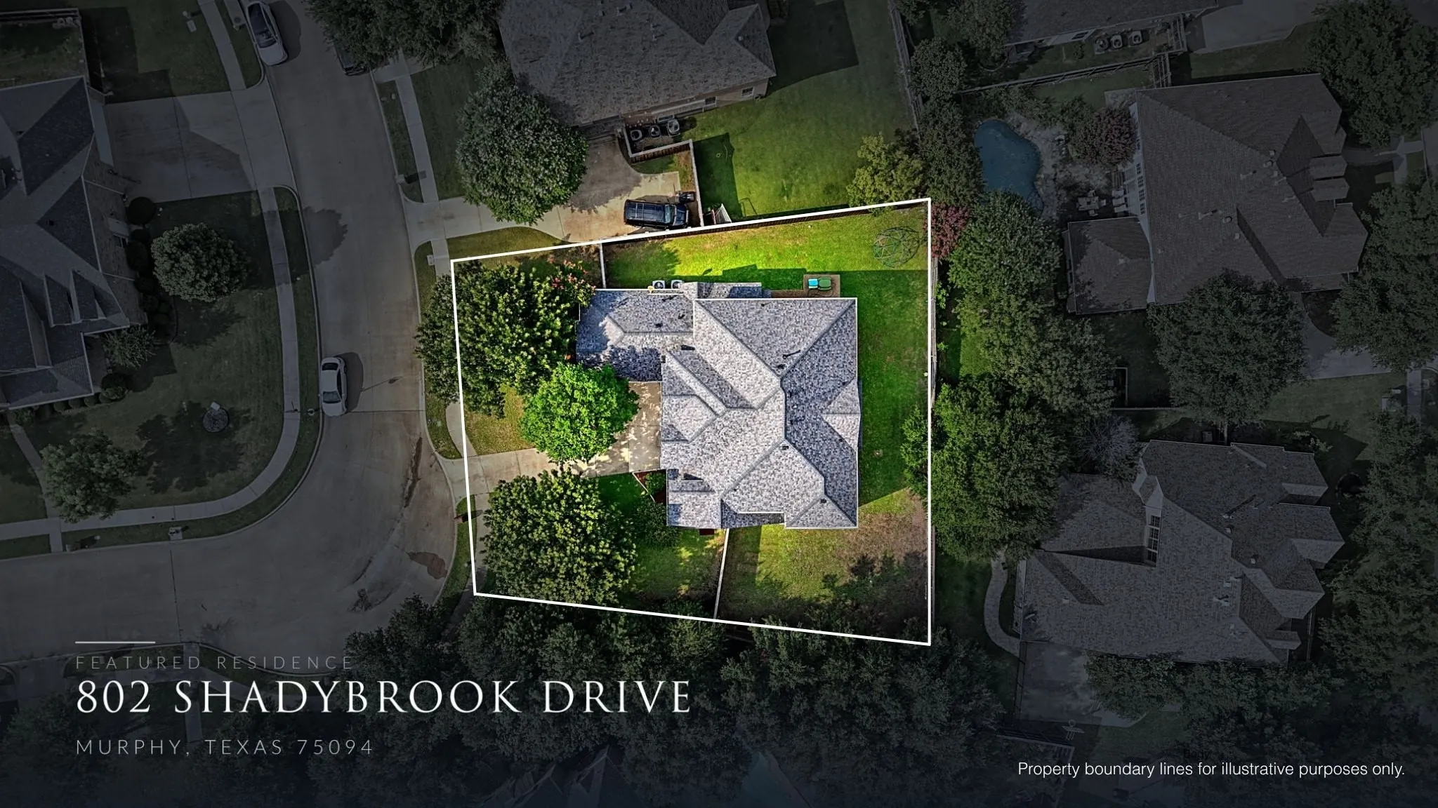 An aerial perspective highlights the home's impressive corner lot, mature trees, and generous separation from neighboring properties.