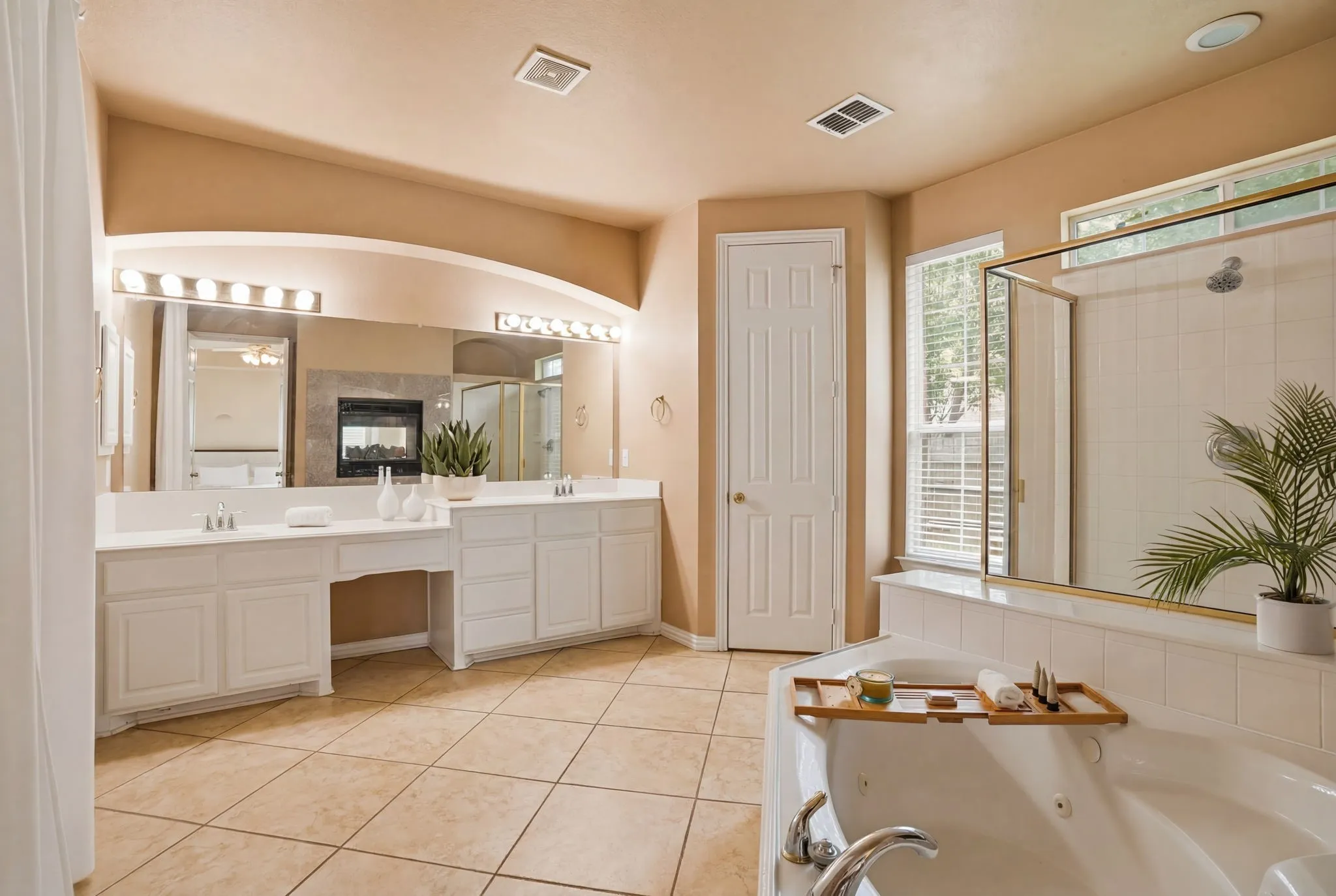 A spacious primary walk-in closet with built-in organization provides room for every season while keeping everything neatly within reach.