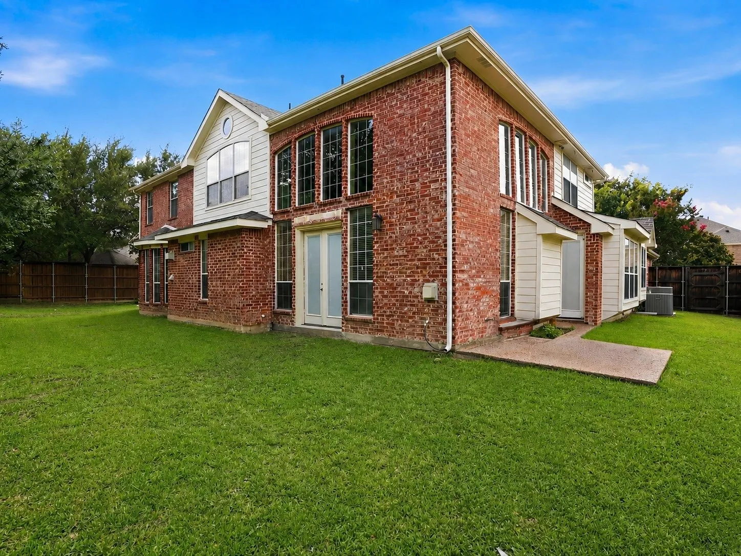 The oversized corner lot provides generous outdoor space with endless potential for entertaining, gardening, play, or future backyard enhancements.