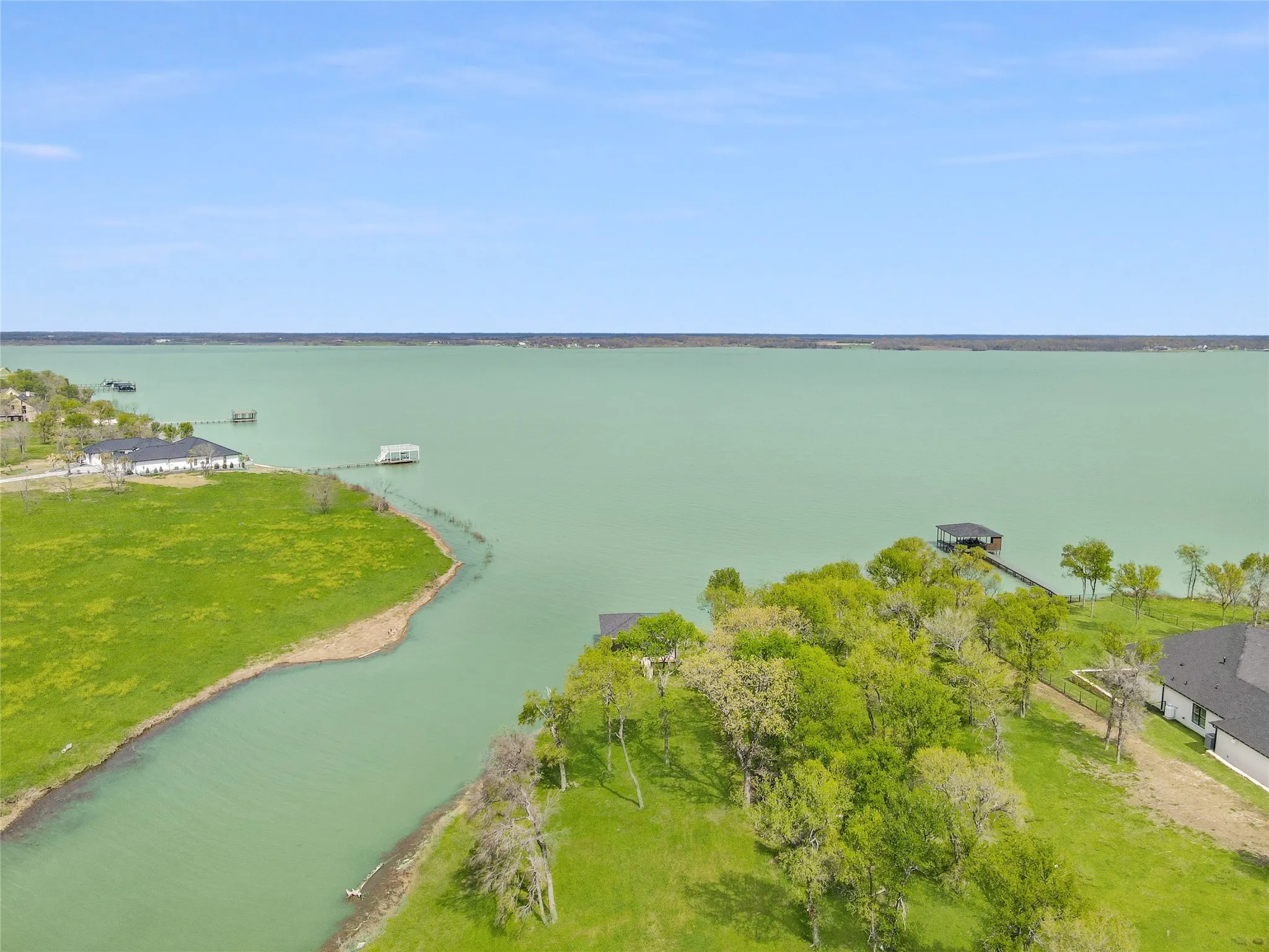 Aerial view highlights the open water setting and peaceful shoreline at this 1.17-acre Richland Chambers Lake homesite.