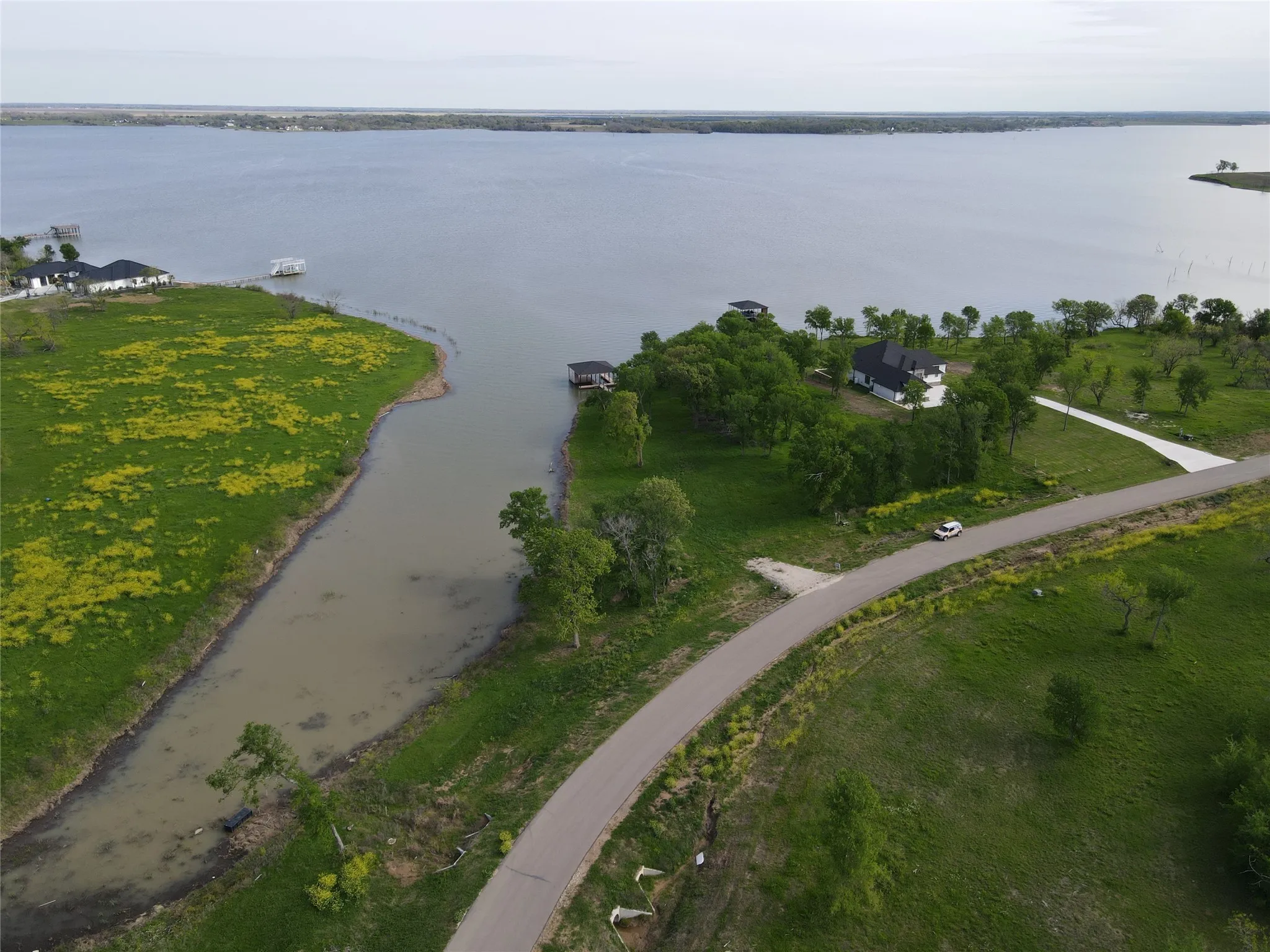 Expansive aerial view captures the cove, open water, and prime Richland Chambers Lake waterfront setting.