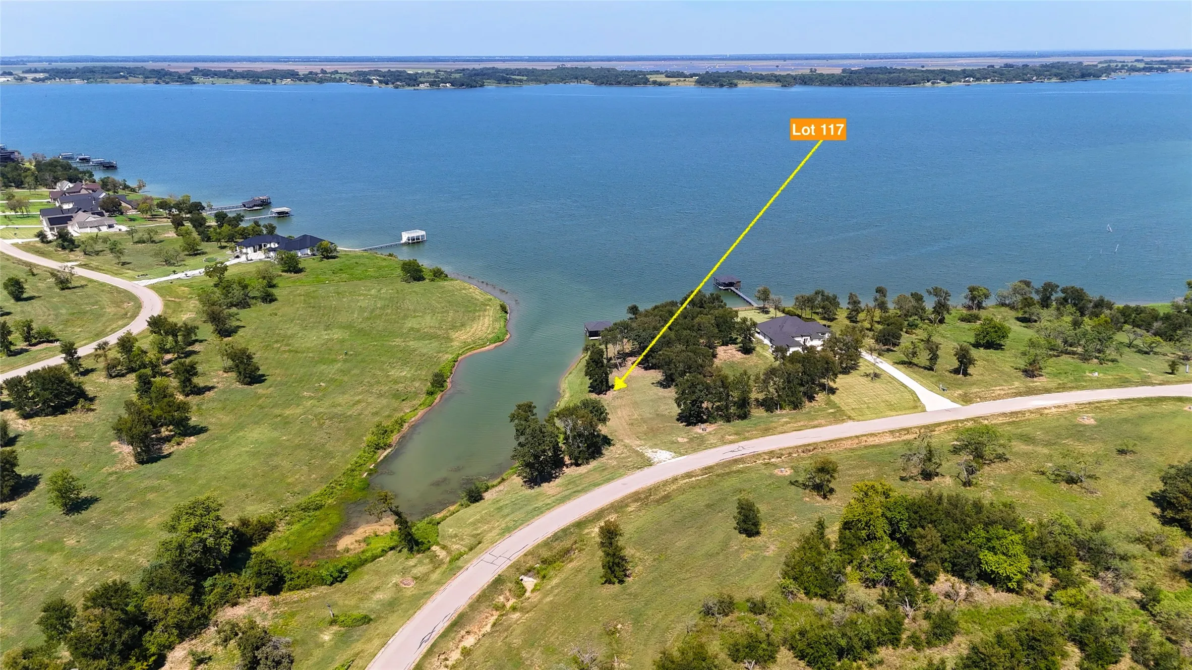 Wide aerial perspective shows the Diamond Point waterfront location with beautiful lake access and open water views.