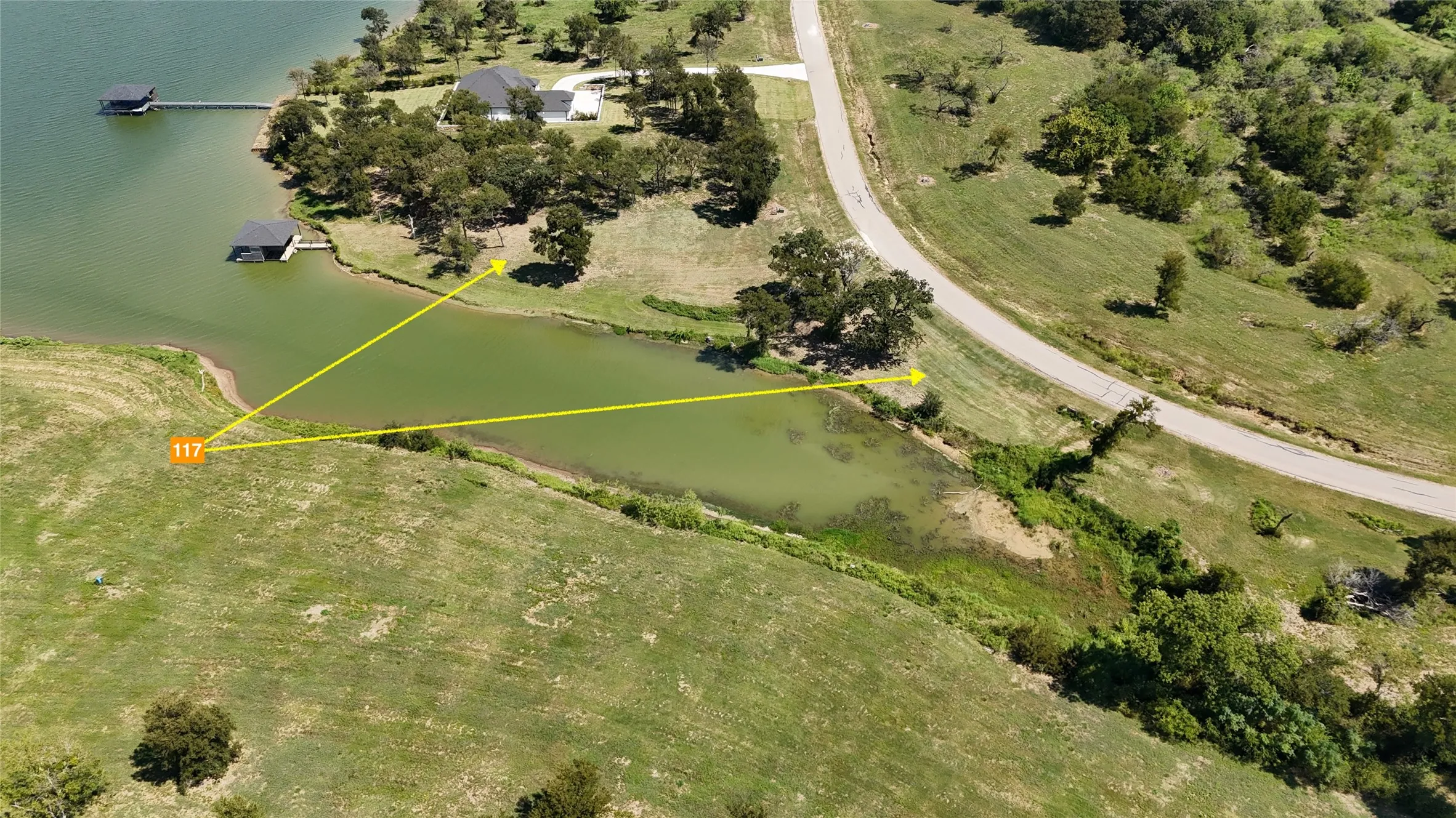 Aerial boundary view showcases the lot layout, shoreline, and gated Diamond Point location near Corsicana, Texas.