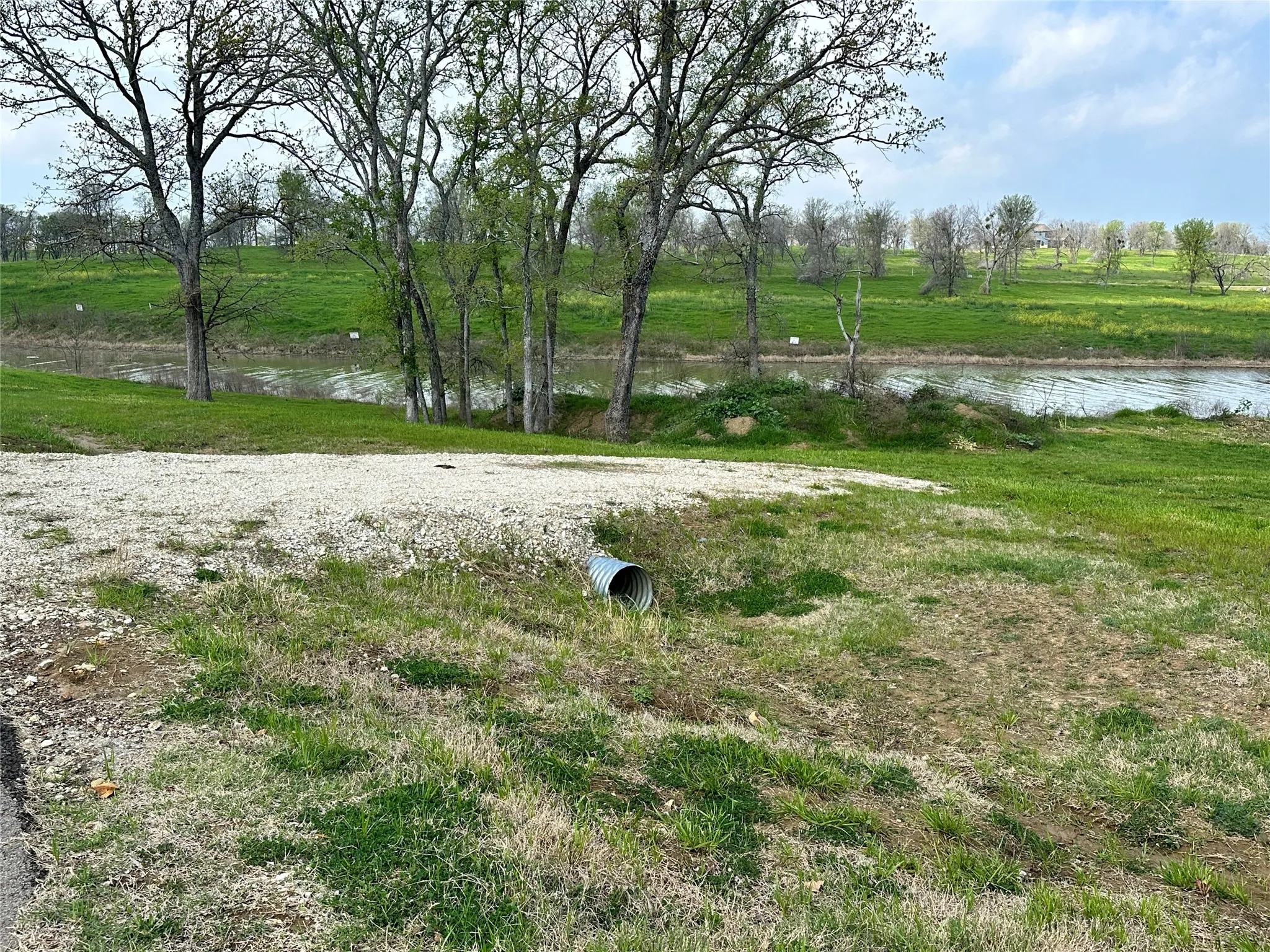 Treed, gently sloped homesite brings natural beauty and peaceful lake views to this Diamond Point property.