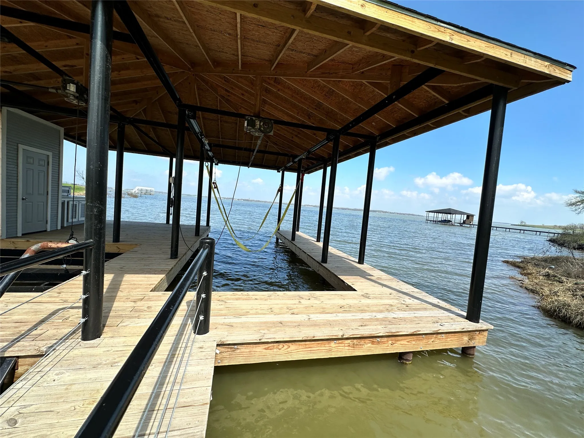 Spacious covered boathouse design is ready for lake days, entertaining, and Richland Chambers Lake adventures.
