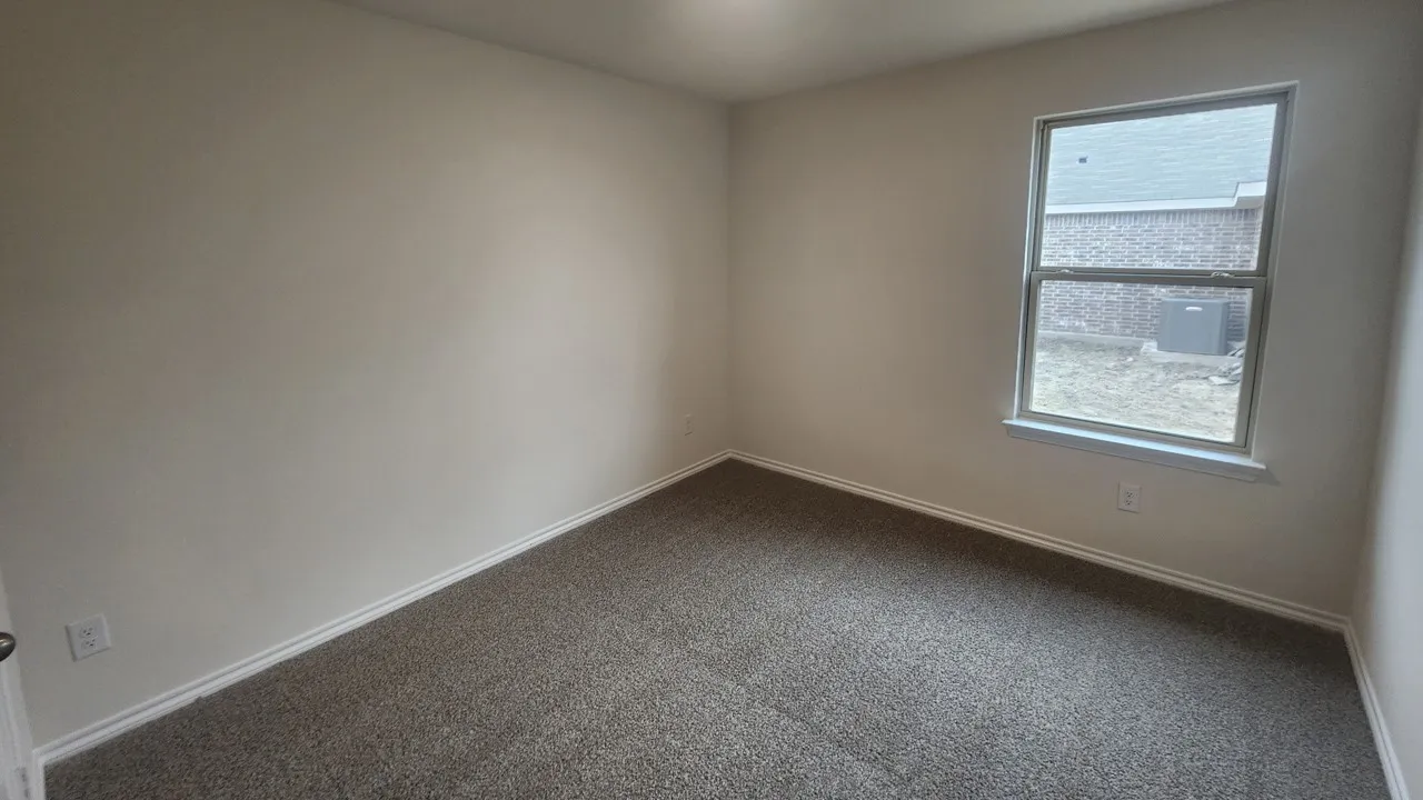 Neutral-toned wall paint and matching carpet flooring