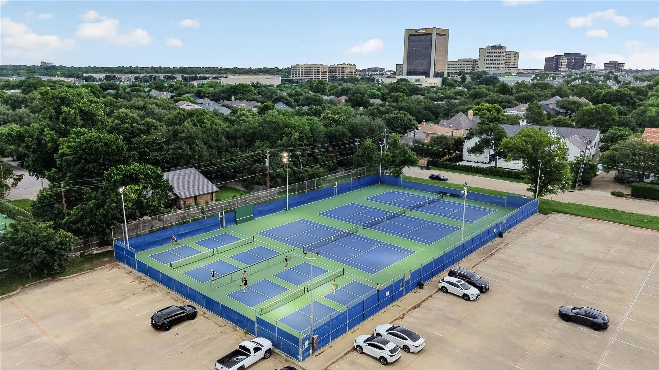 Outdoor recreational complex featuring multiple tennis courts and pickleball courts