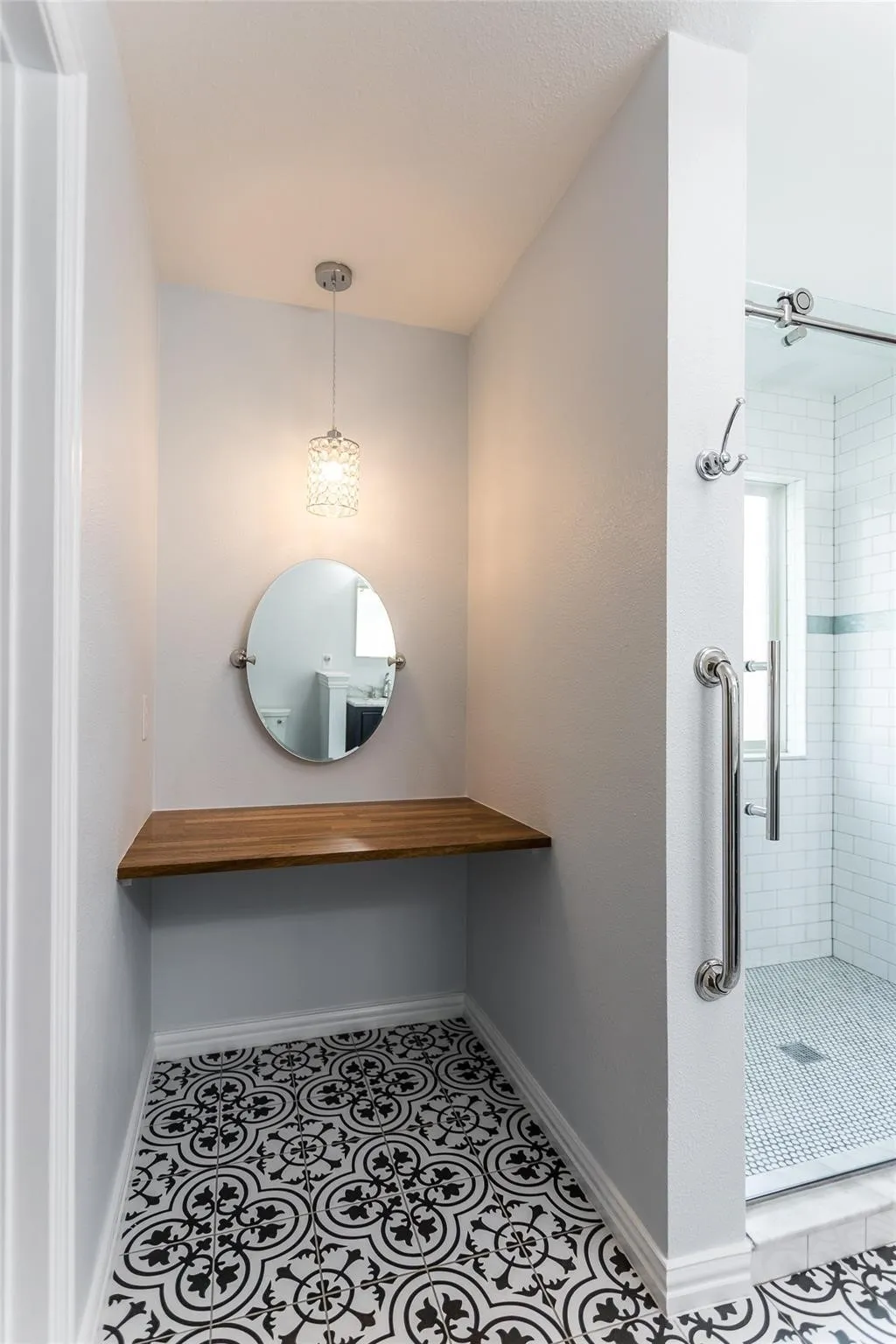 Full bath with tile patterned flooring, a shower stall, and vanity