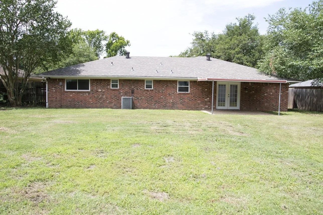 large yard with covered patio
