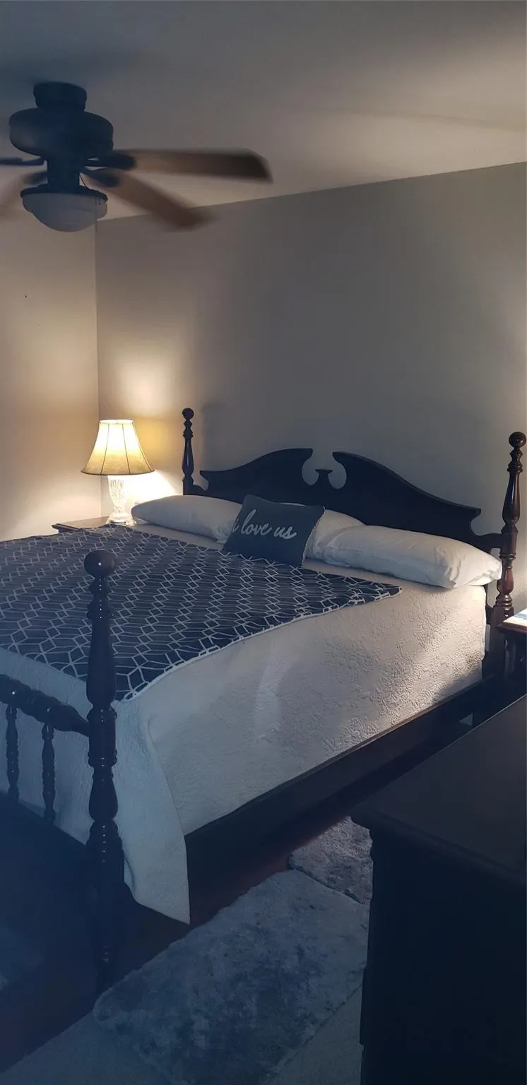 Bedroom featuring carpet floors and ceiling fan