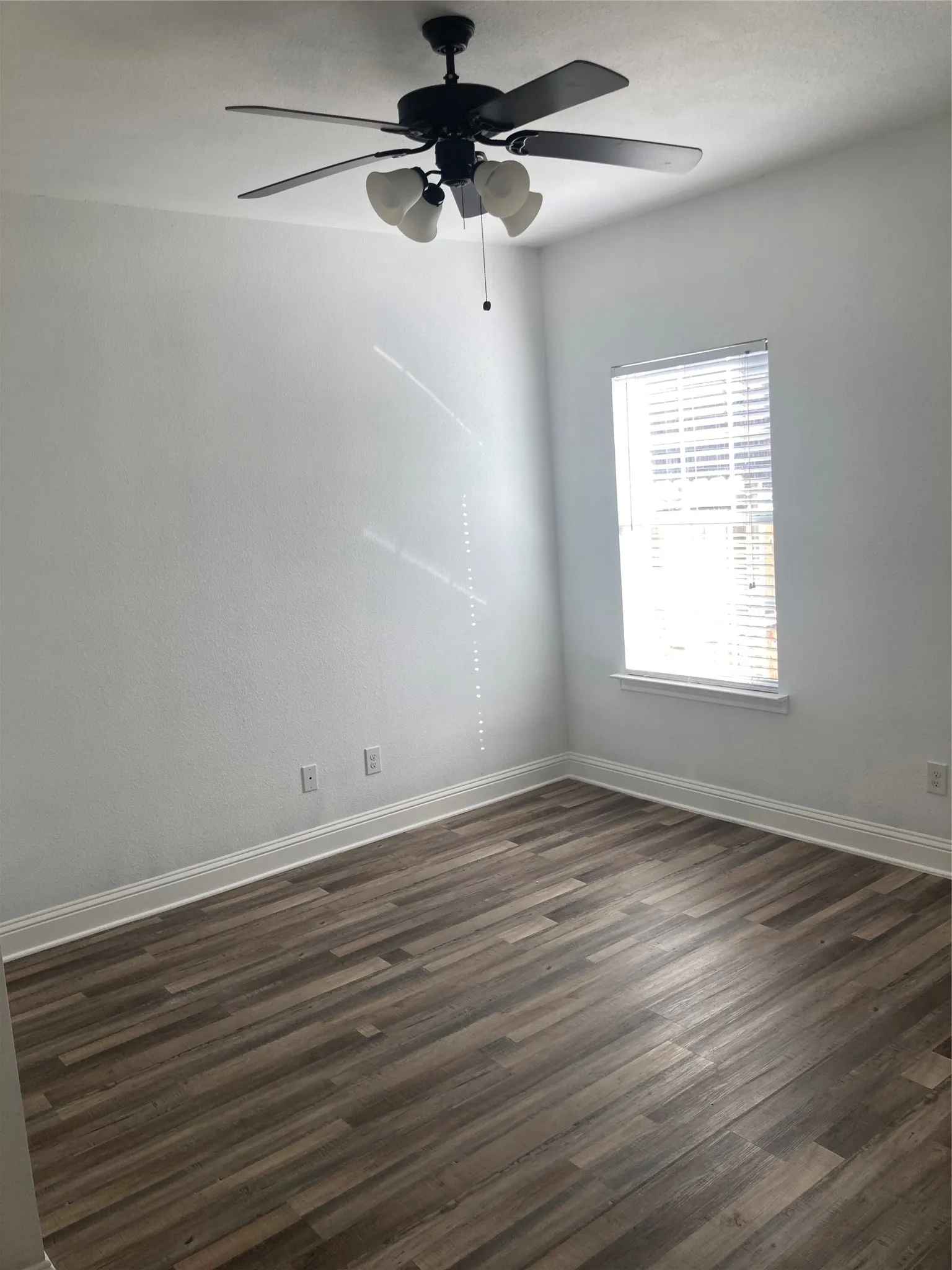 Bedroom #3 has a ceiling fan and new vinyl flooring.
