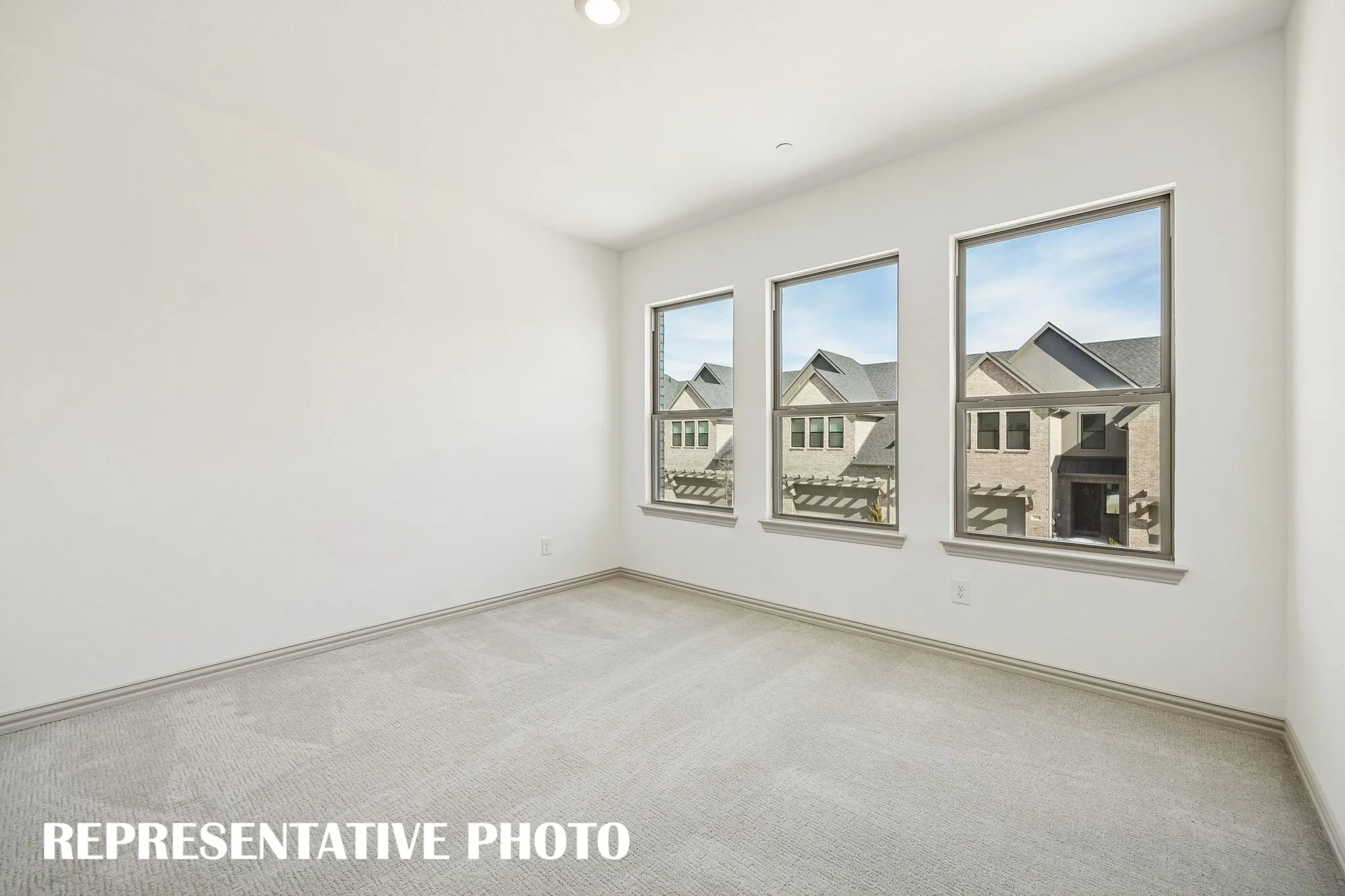 You'll find nicely sized secondary bedrooms in our Walker floor plan.  REPRESENTATIVE PHOTO