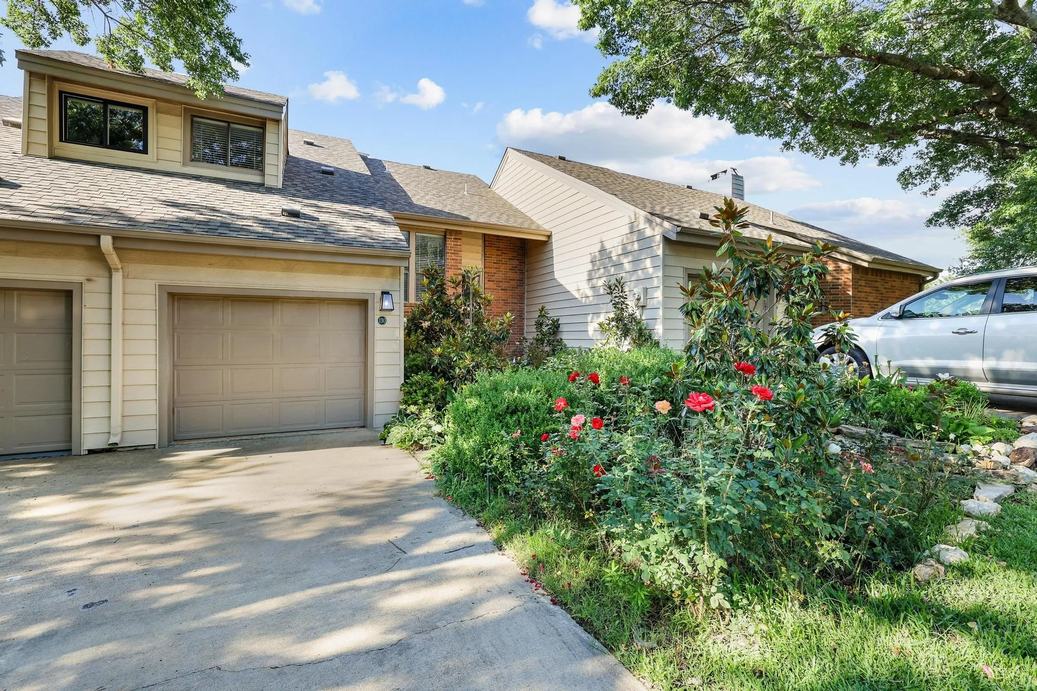 Property has a single car garage with additional driveway parking