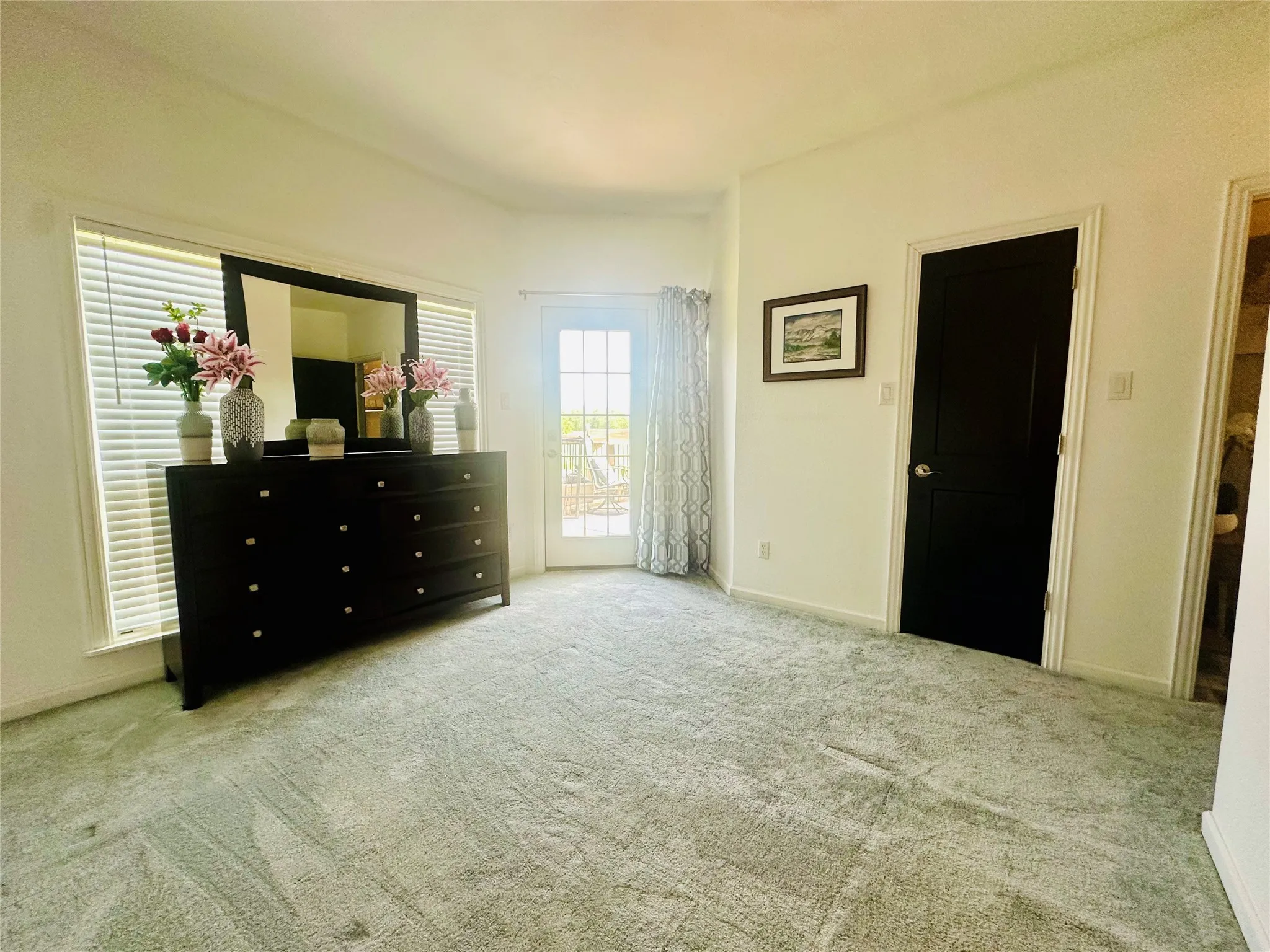 Upstairs secondary bedroom has access to the upper rear deck