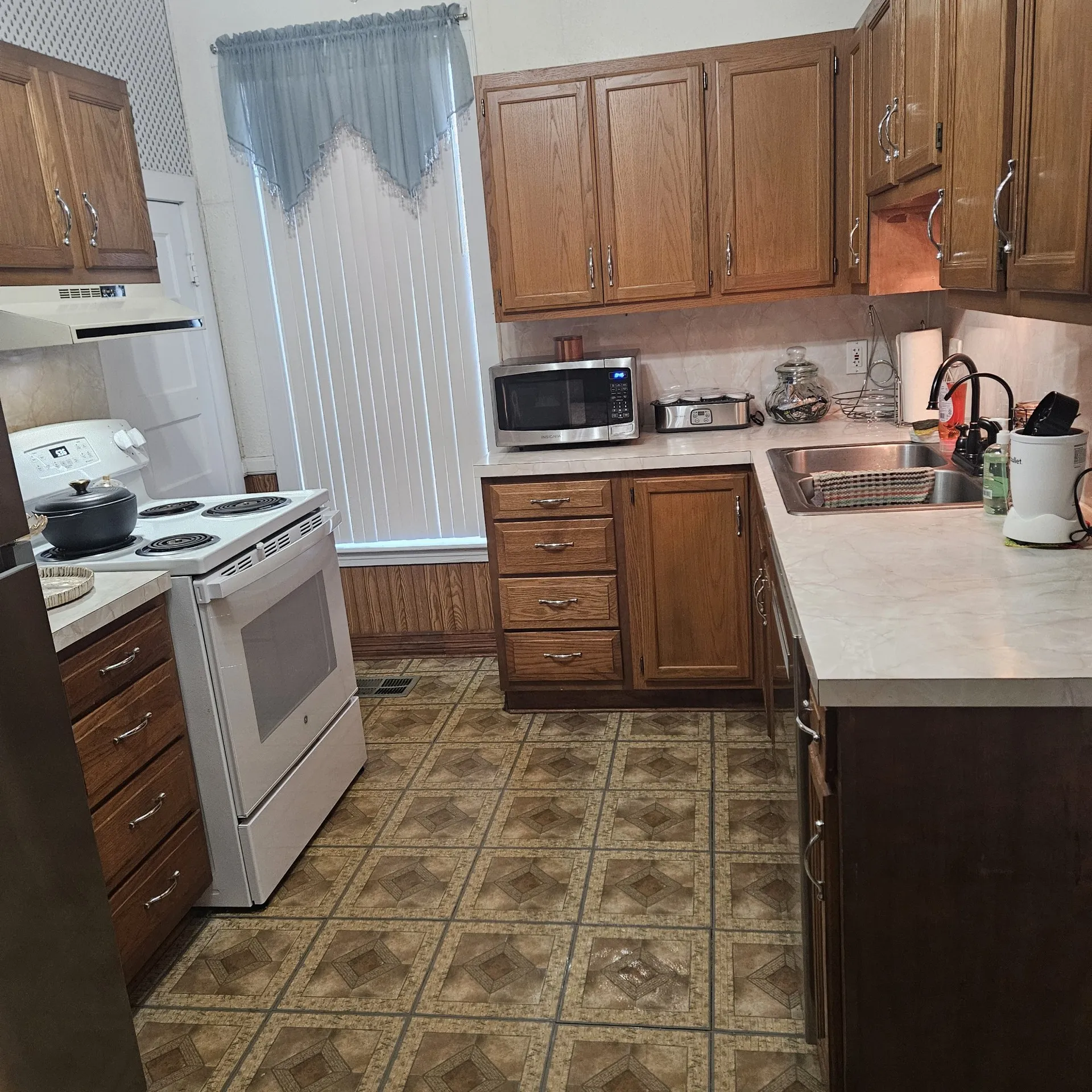 newer electric range, dishwasher, counter tops and water filtration system