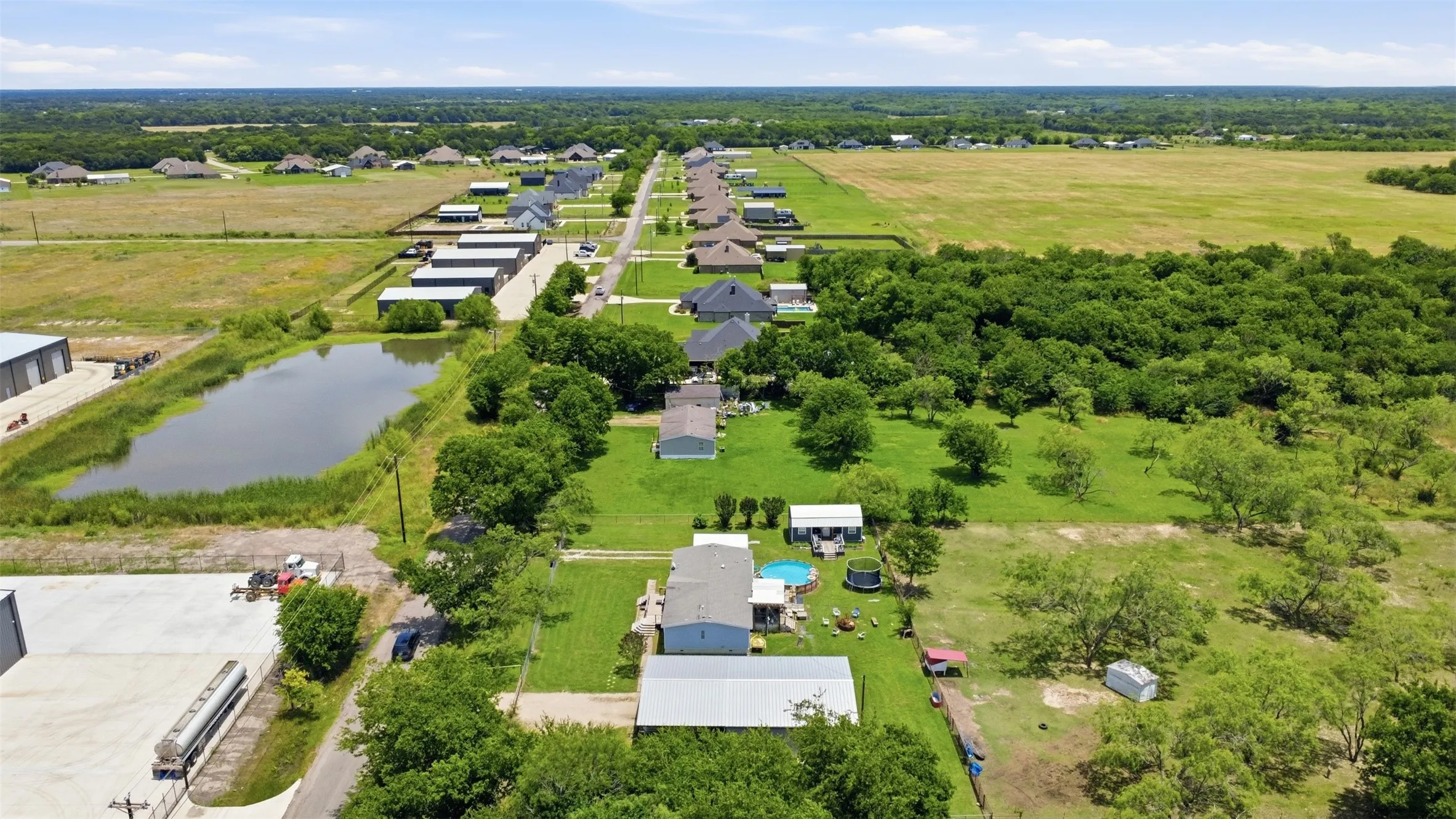 Aerial perspective showcasing residential properties amidst expansive green spaces