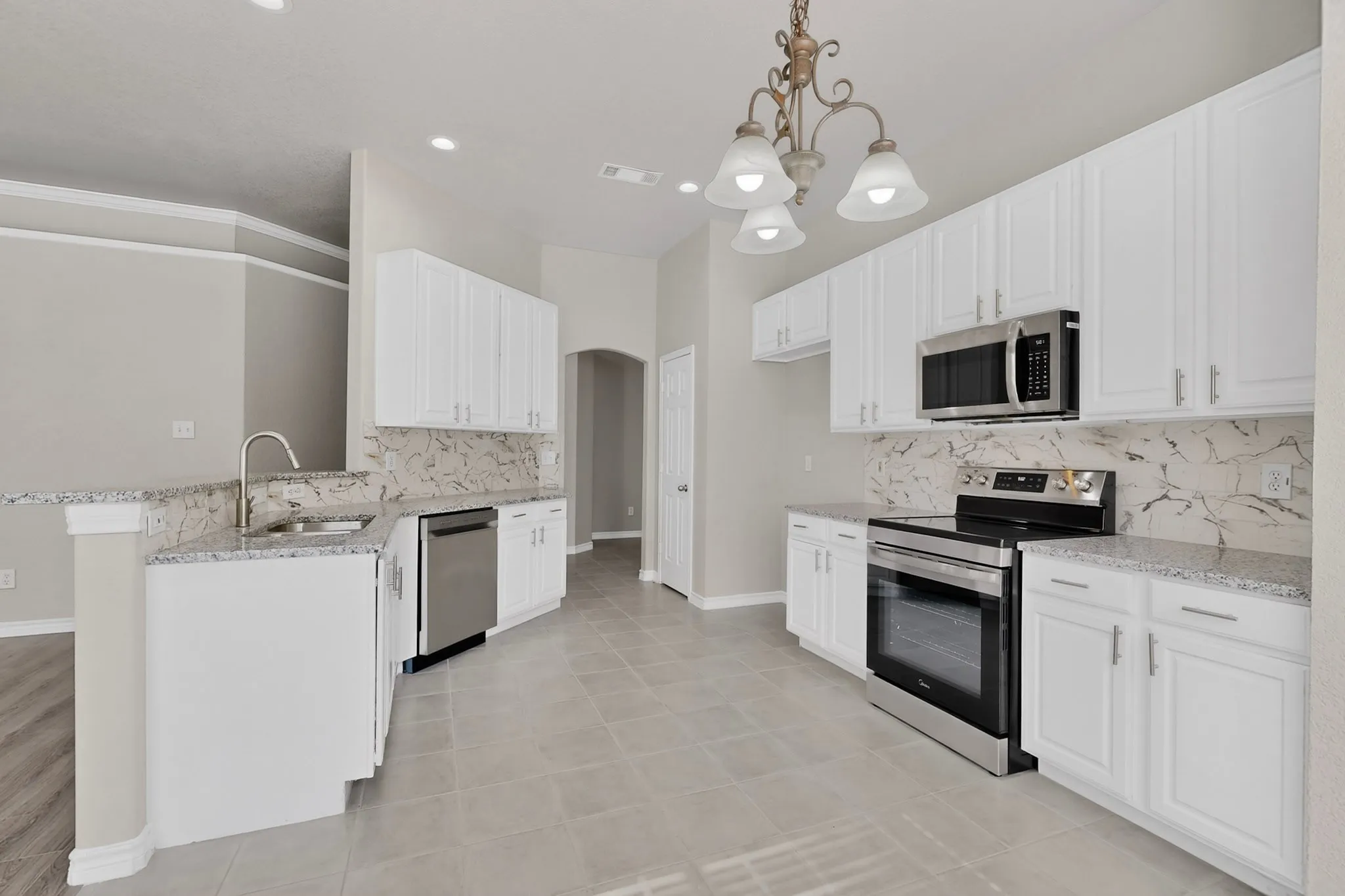 From the Foyer into the Kitchen- New Appliances, Granite Countertops, New Backsplash and Ceramic Tile Flooring